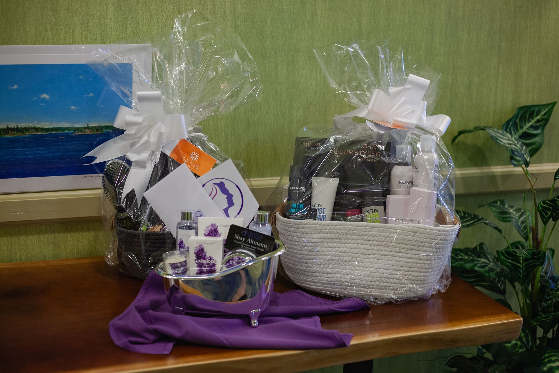 Two gift baskets are sitting on a wooden table.