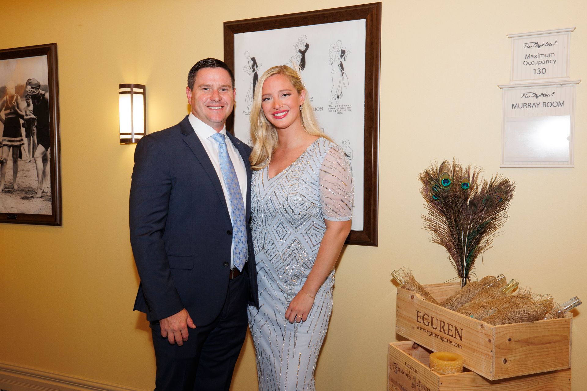 A man and a woman are posing for a picture in a room.