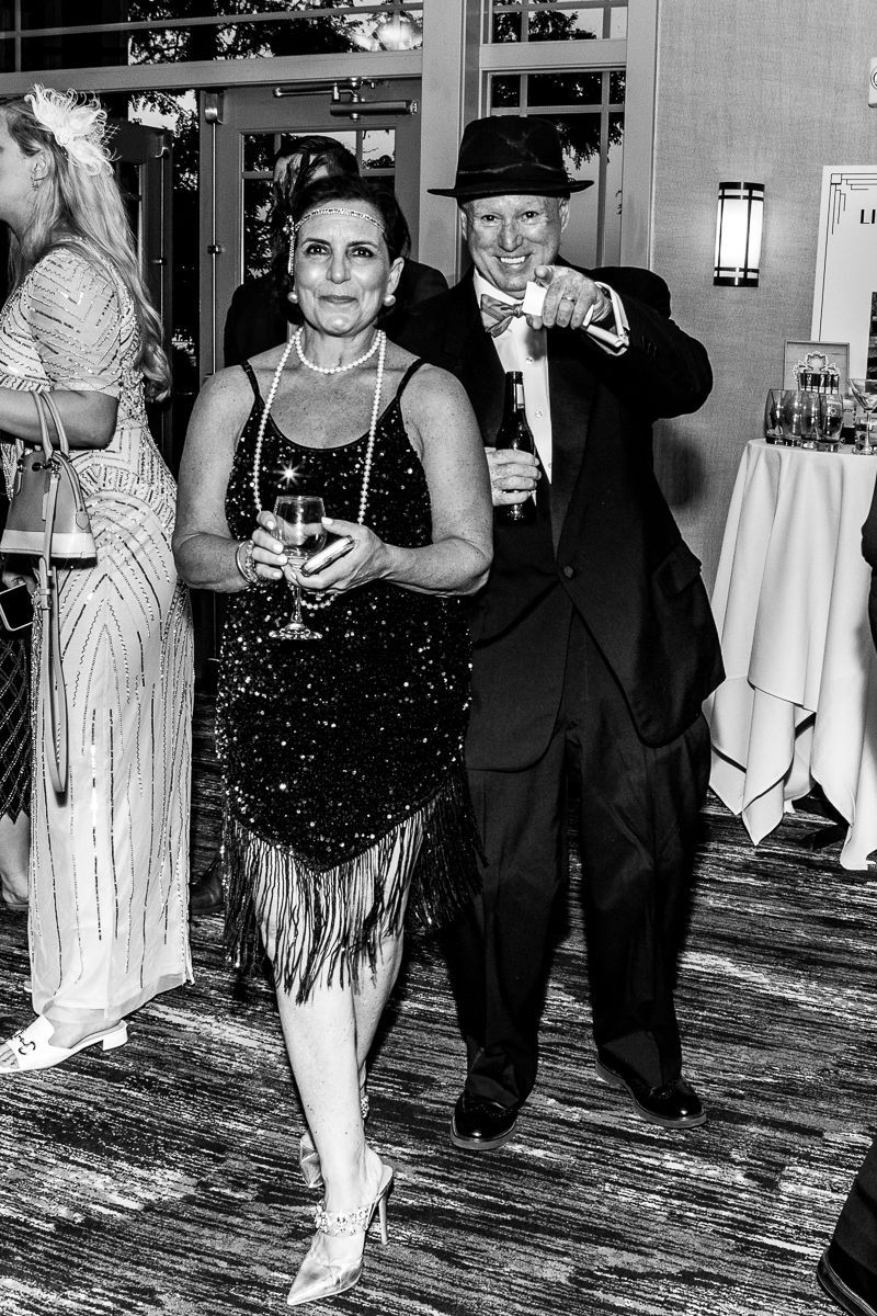 A black and white photo of a man and woman dancing