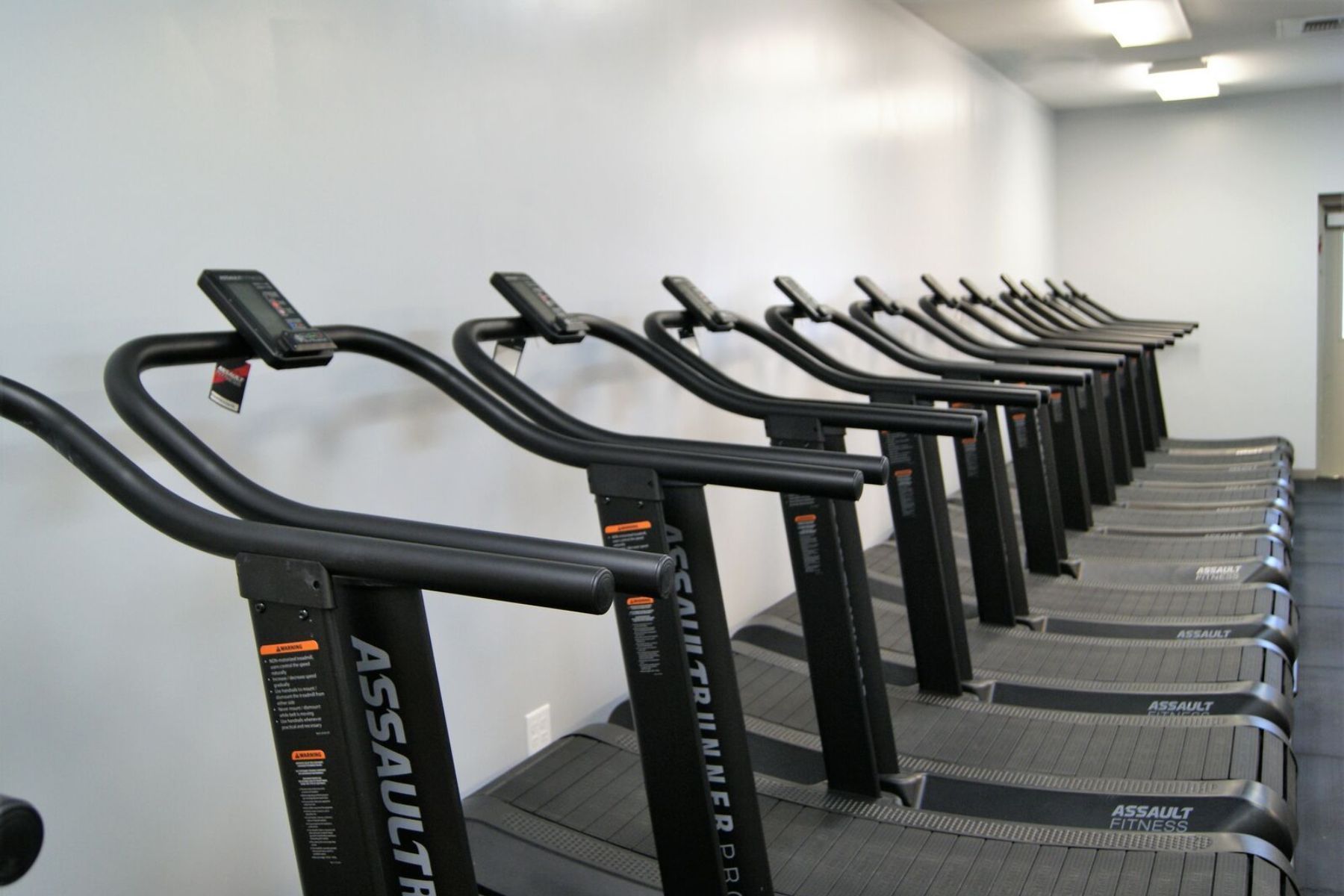 A row of assault treadmills in a gym