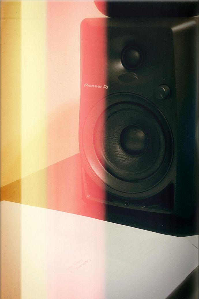 A pioneer speaker is sitting on a table