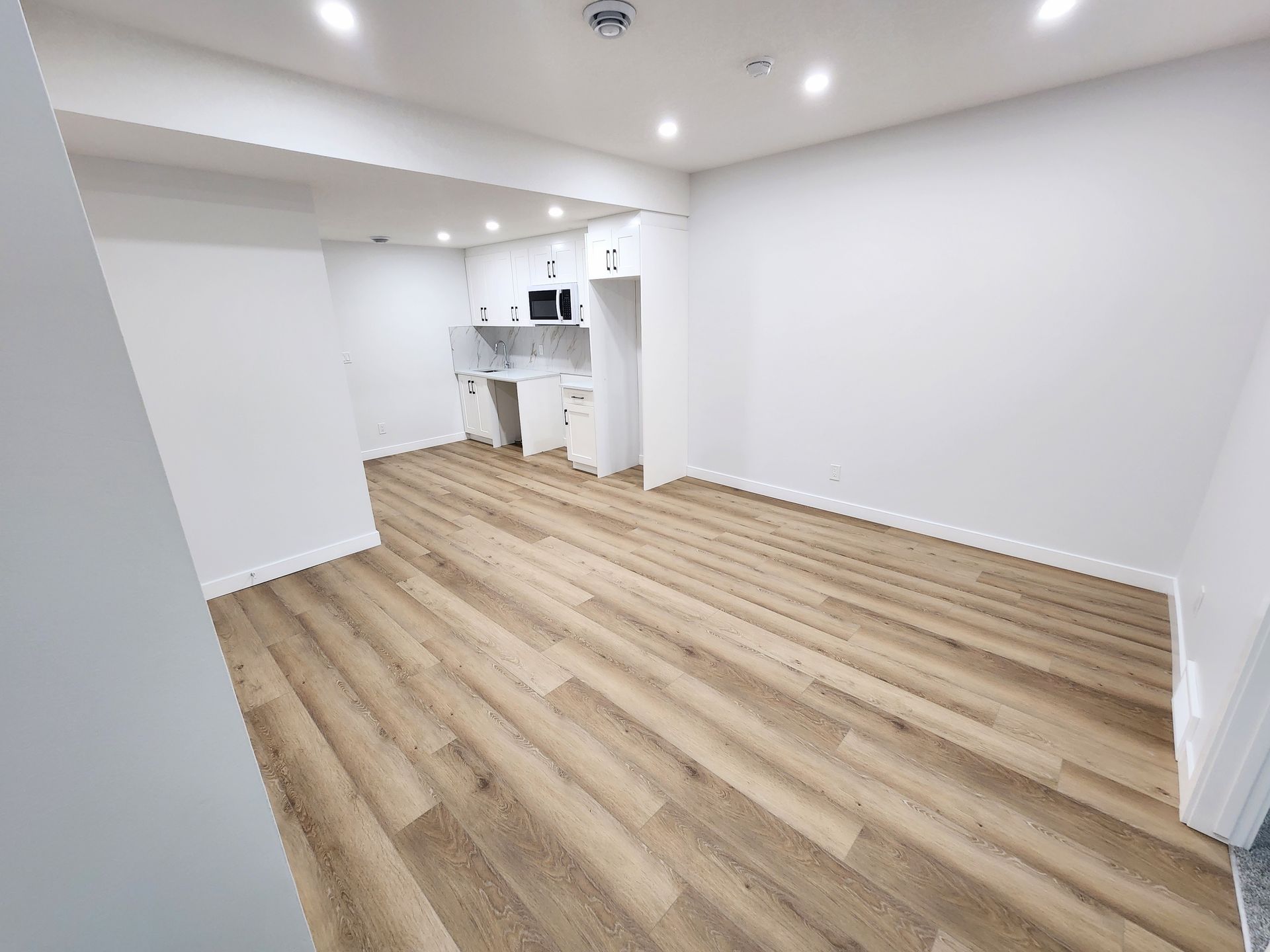 Basement living area finished with LVP