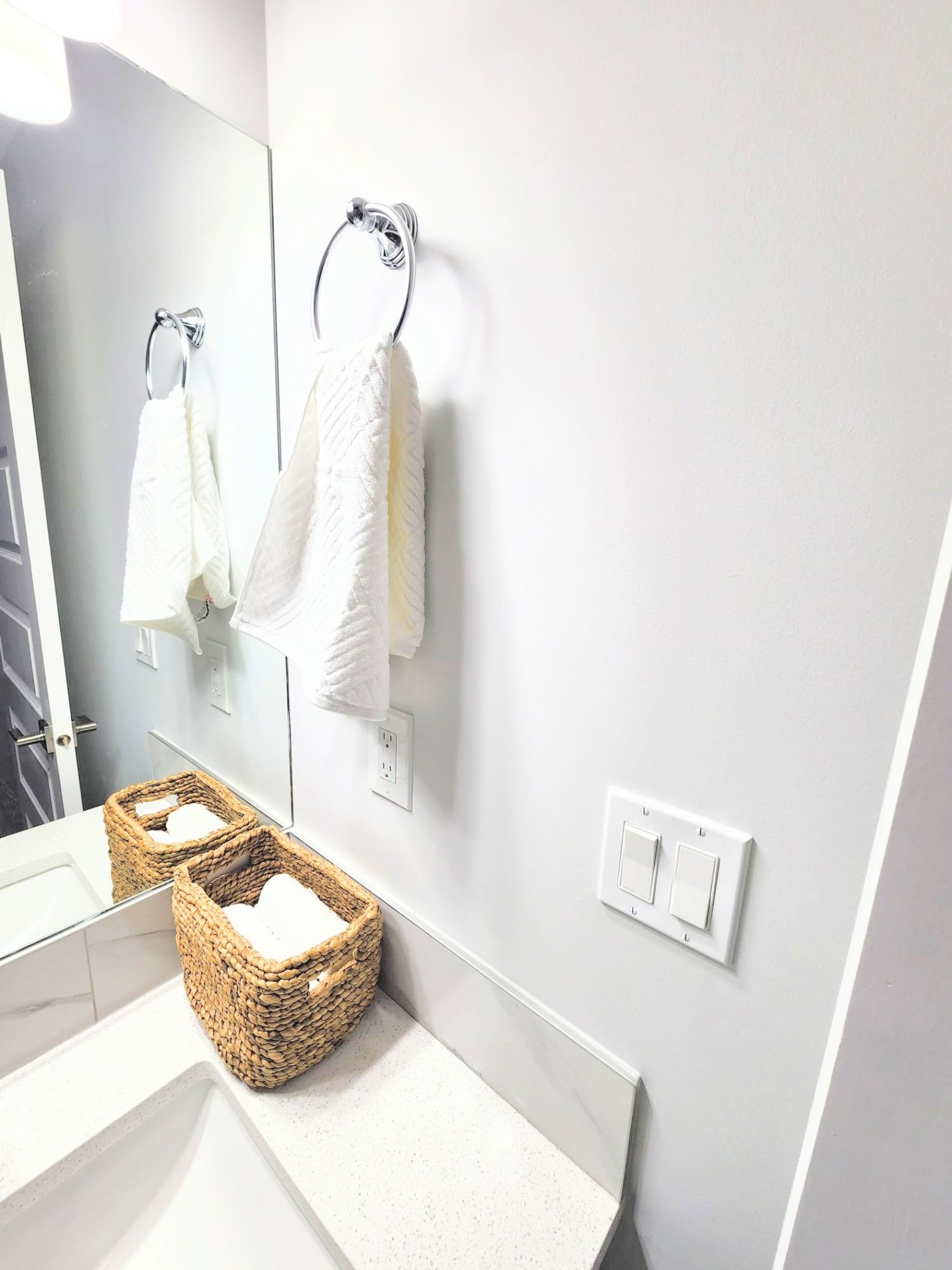 Image showing a hand towel hung in a 3 piece bathroom in a finished basement in Calgary