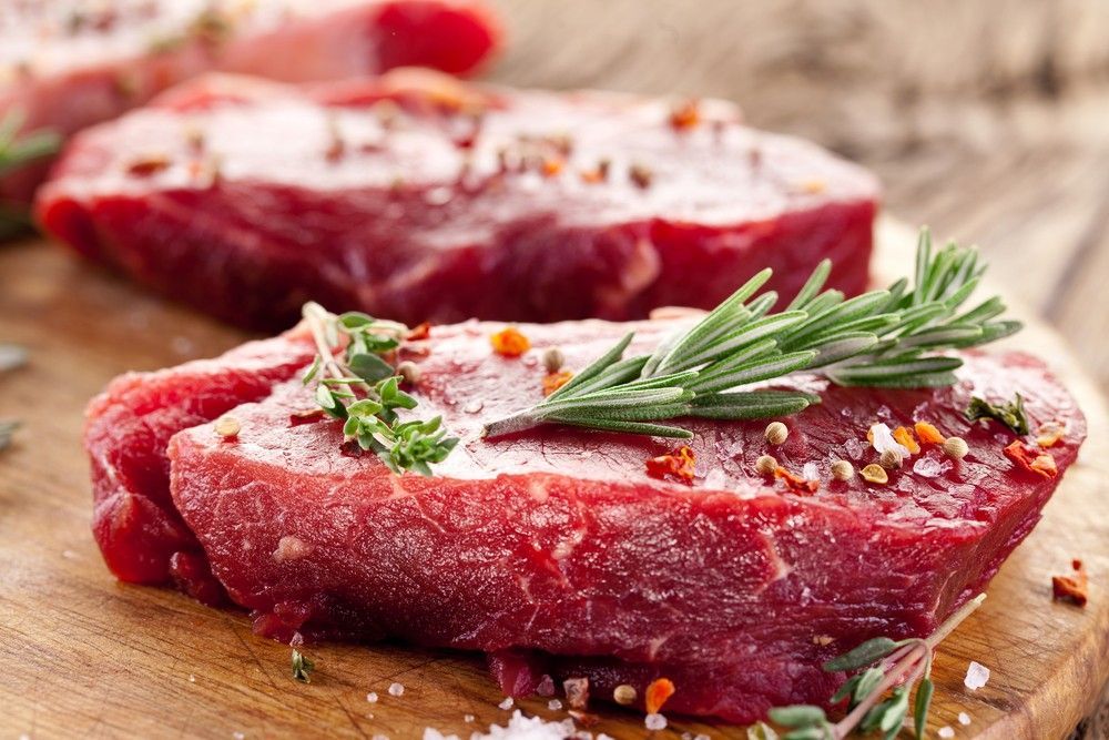 Raw Steaks Seasoned with Herbs and Spices — Romanas Italian Restaurant in Nobby Beach, QLD