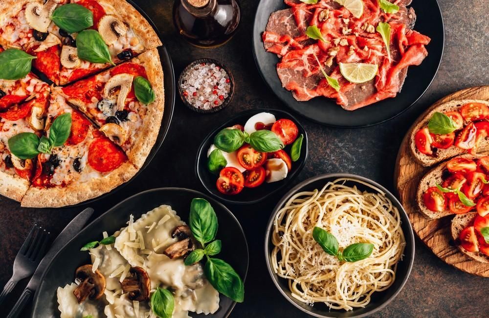 Overhead View of Various Italian Dishes — Romanas Italian Restaurant in Nobby Beach, QLD