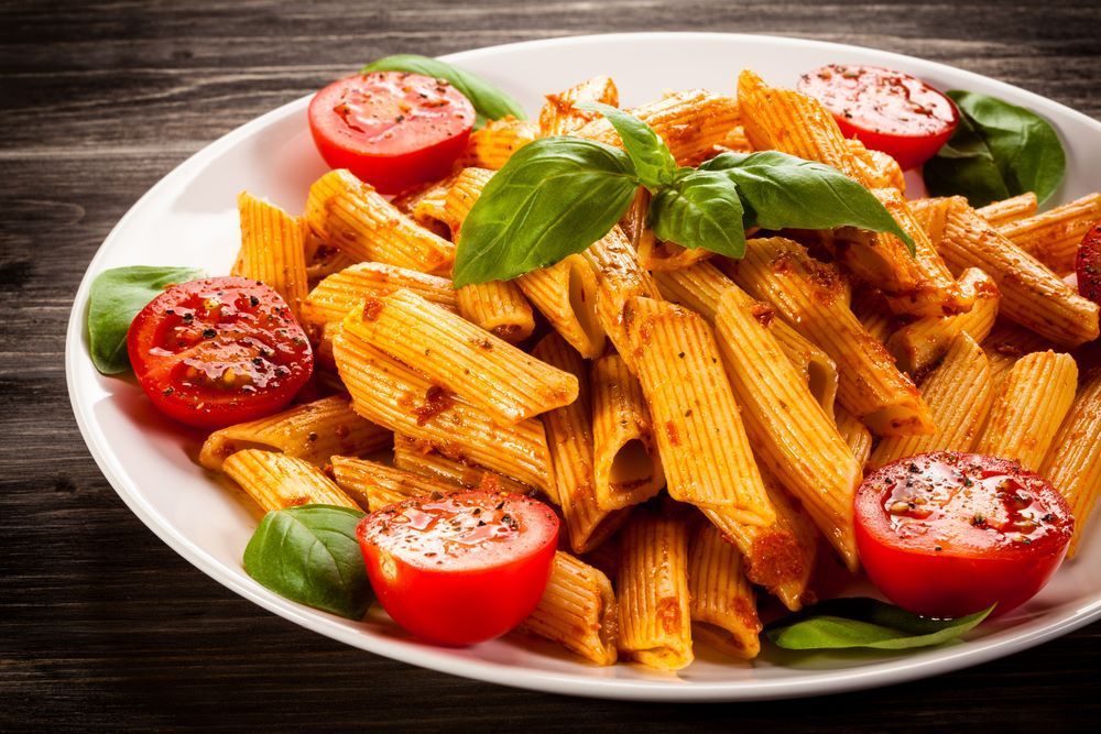 Plate of Penne Pasta with Tomato Sauce — Romanas Italian Restaurant in Nobby Beach, QLD.