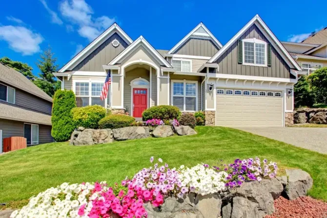 Modern residential home with a perfectly manicured front lawn.