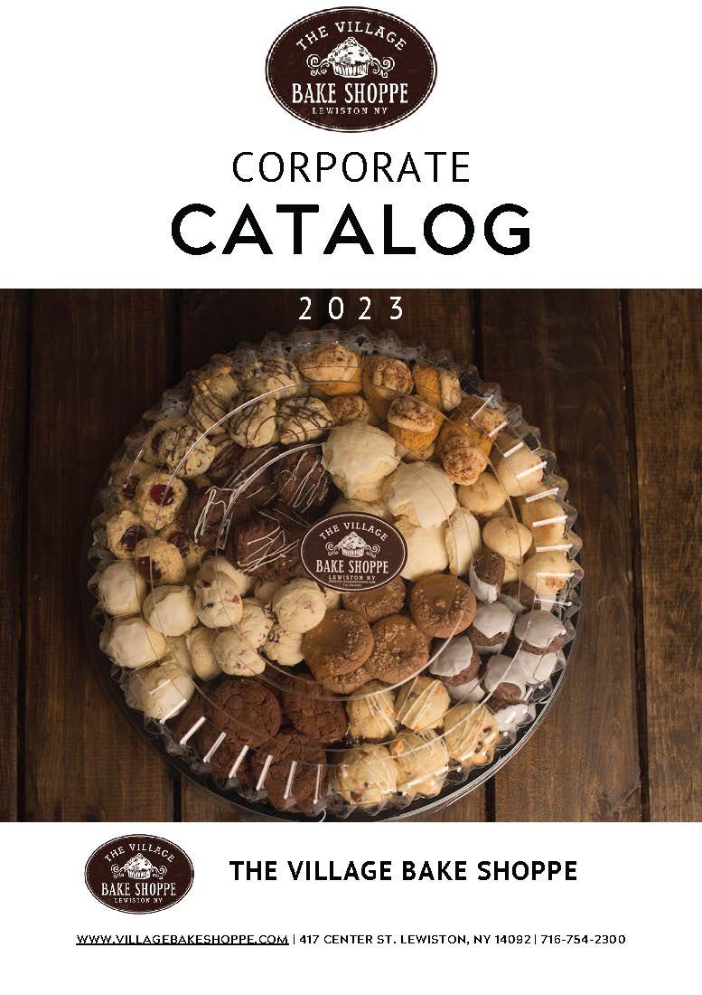 a corporate catalog for the village bake shoppe with a plate of cookies on a wooden table .