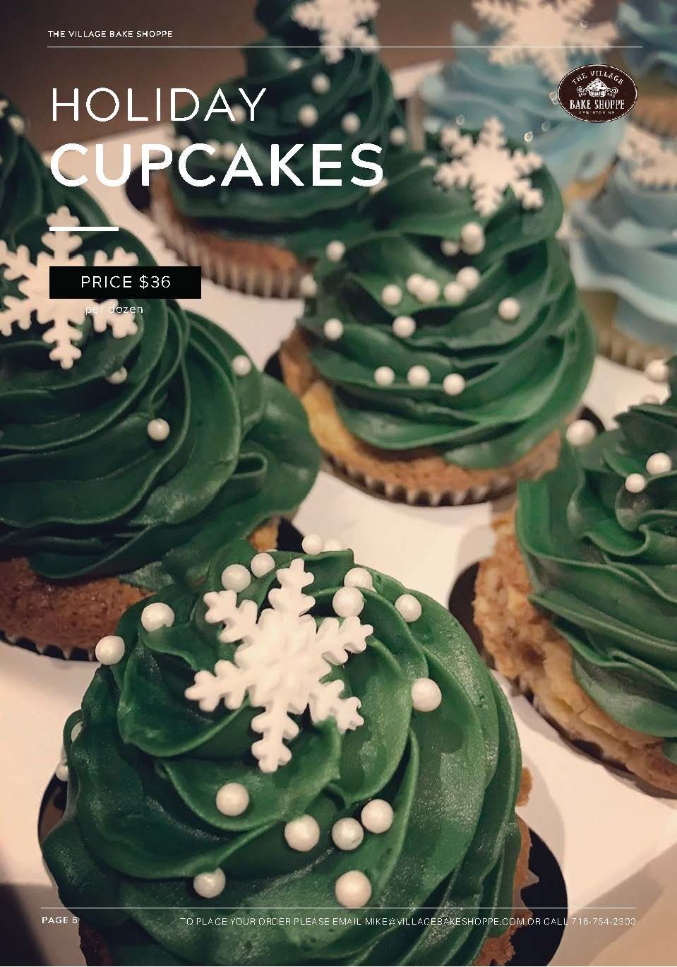 a box of holiday cupcakes with green frosting and snowflakes