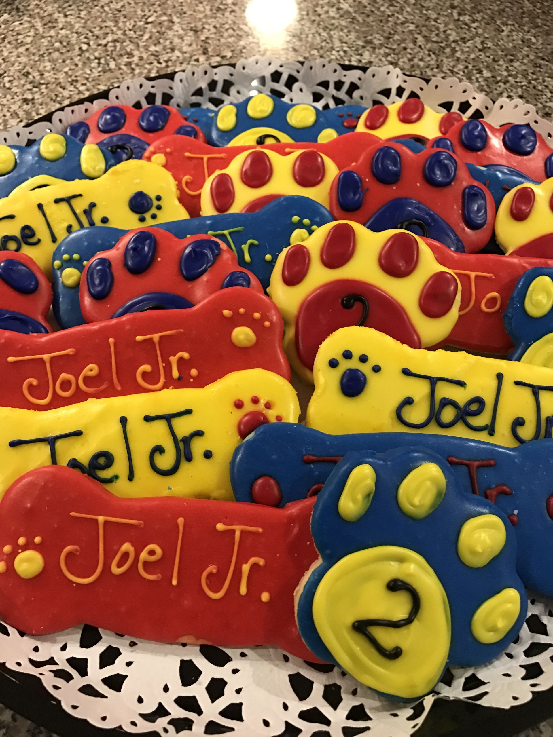 a bunch of cookies with the name joel jr. on them