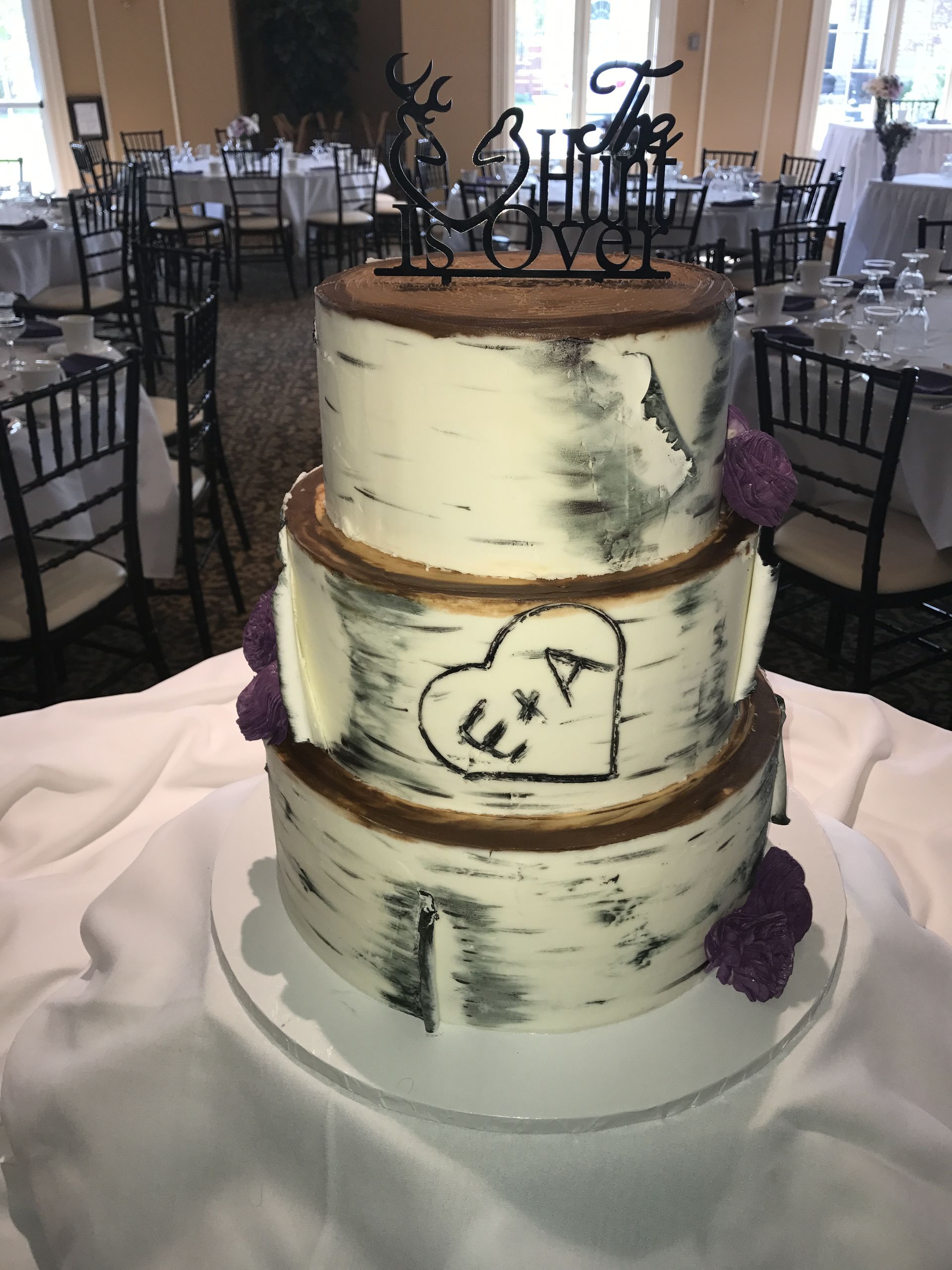 a wedding cake is sitting on a table in a restaurant