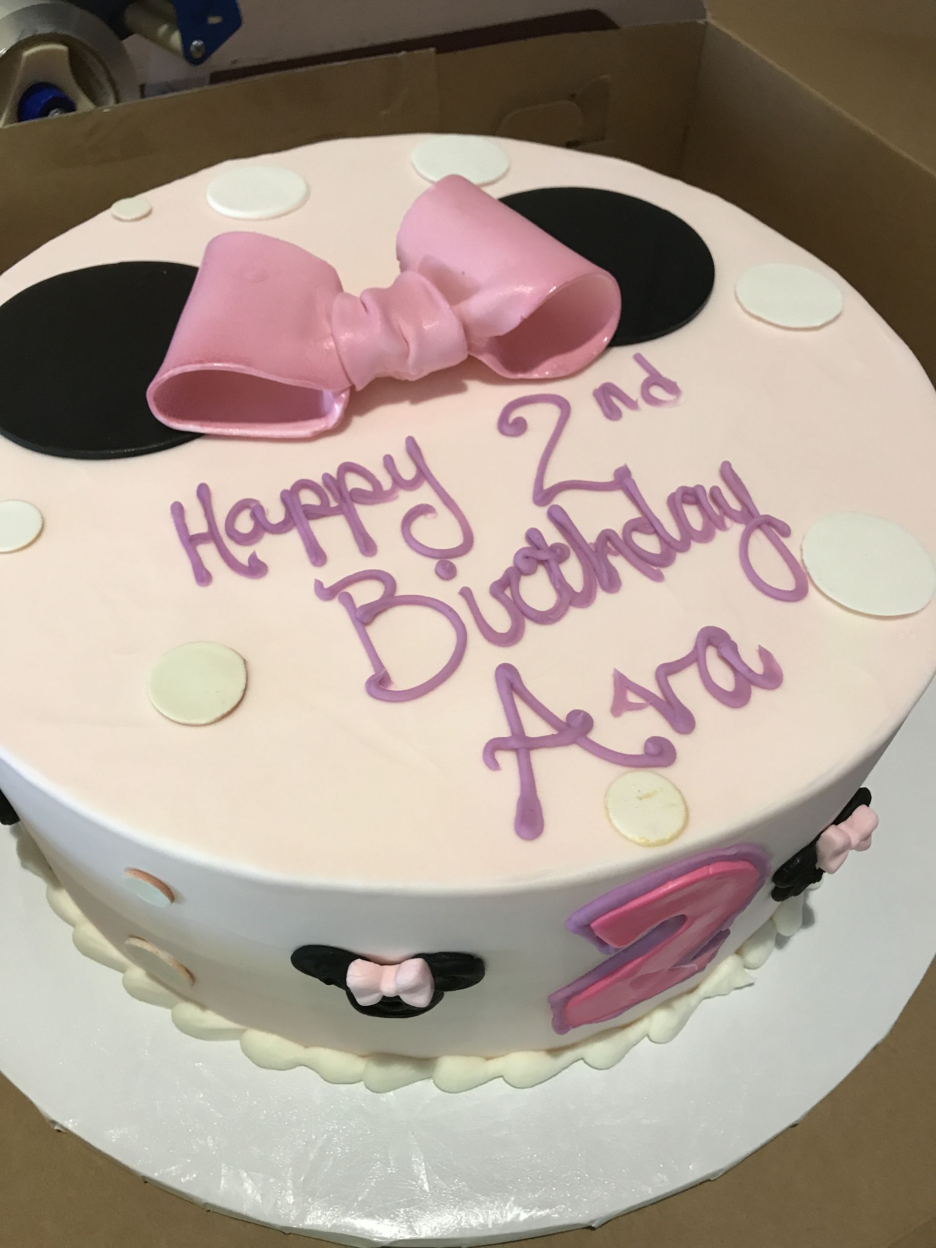 a cake that says happy 2nd birthday ara on it