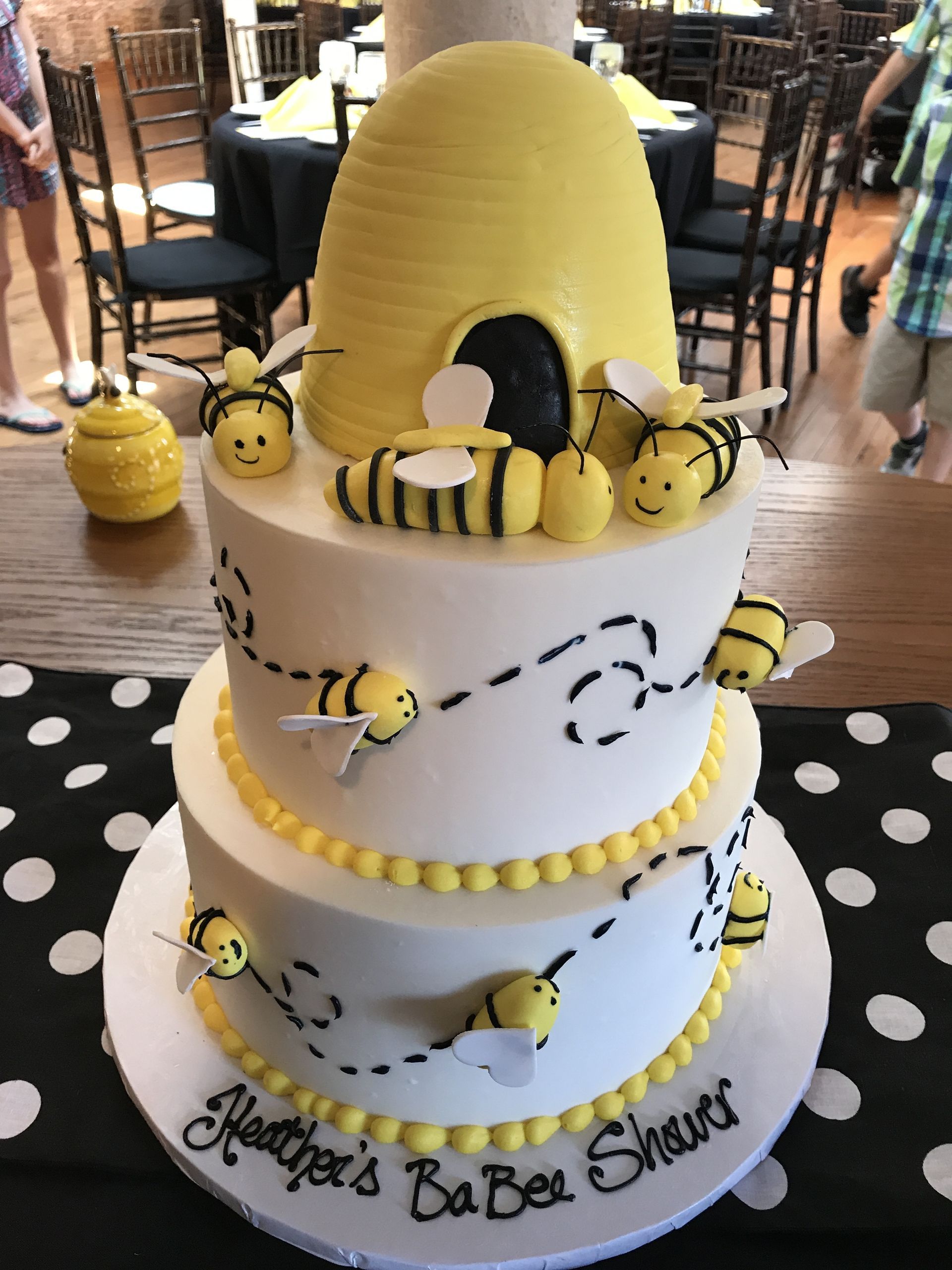 a baby shower cake with bees and a beehive on it