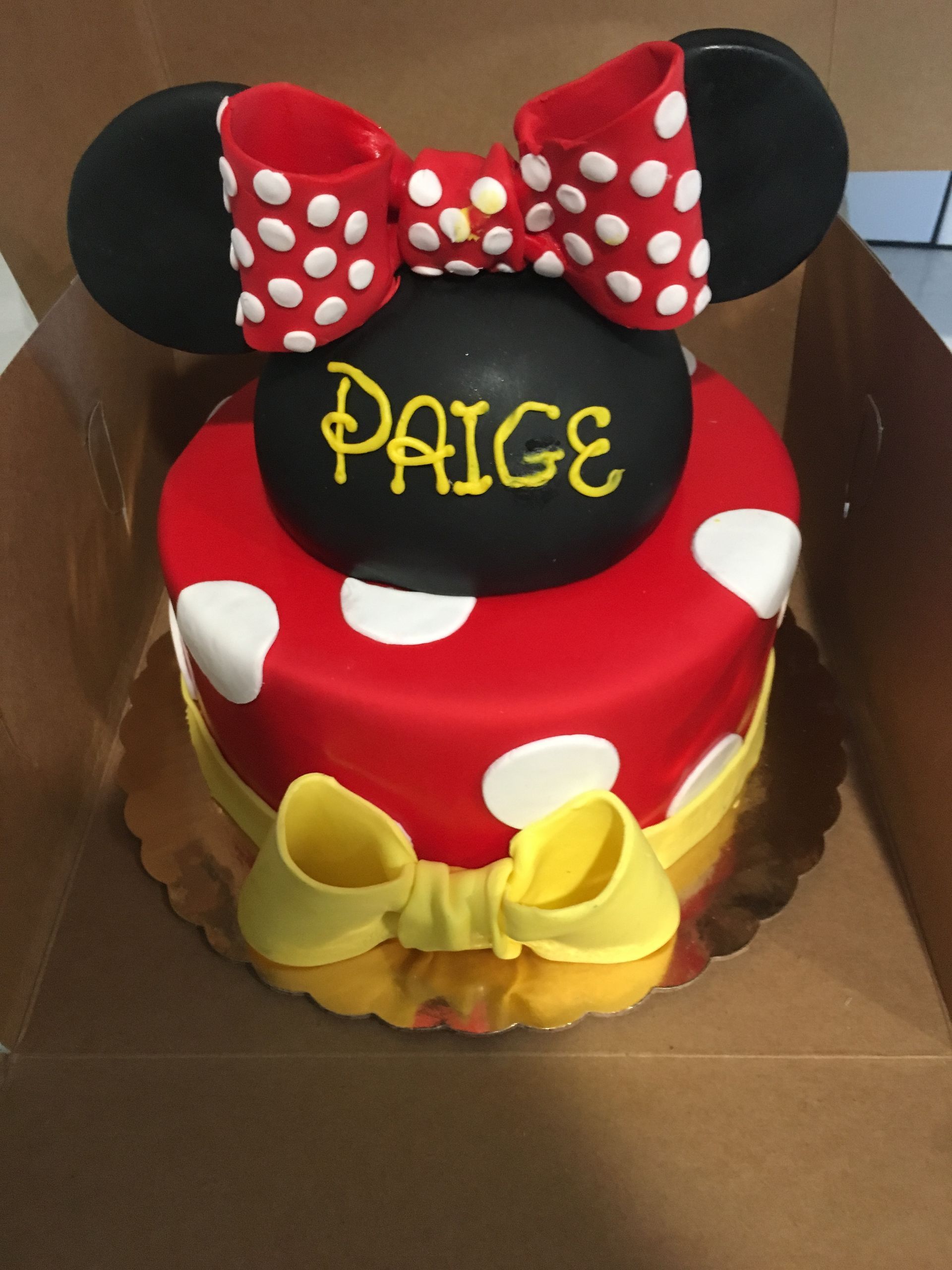a minnie mouse cake with the name paige on it