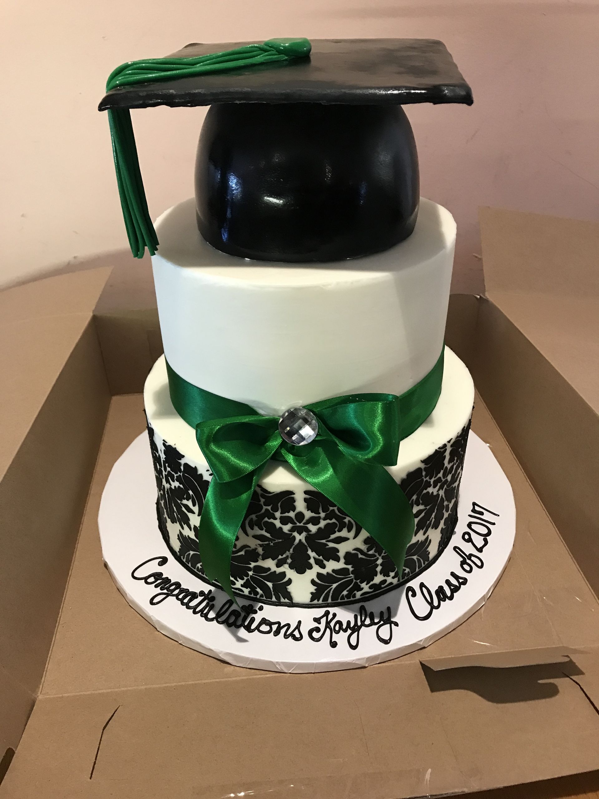 a cake with a graduation cap on top of it