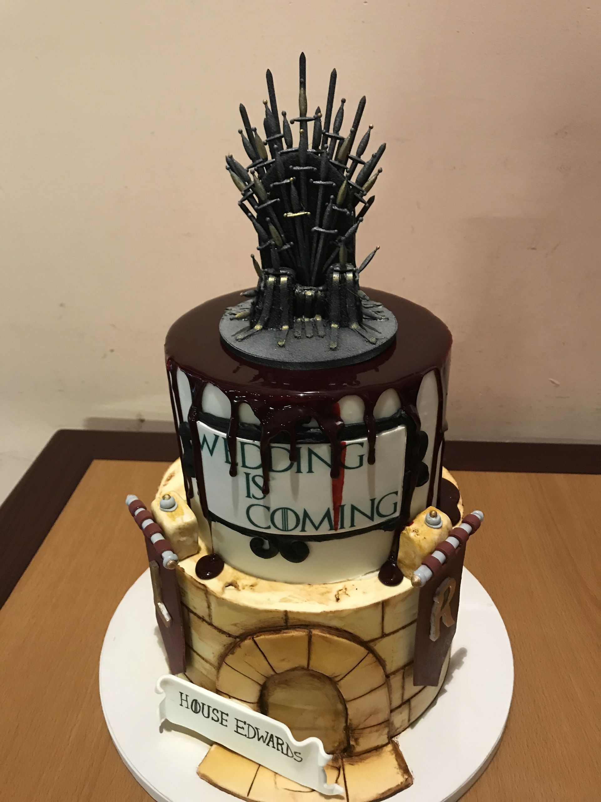 a game of thrones cake with a throne on top