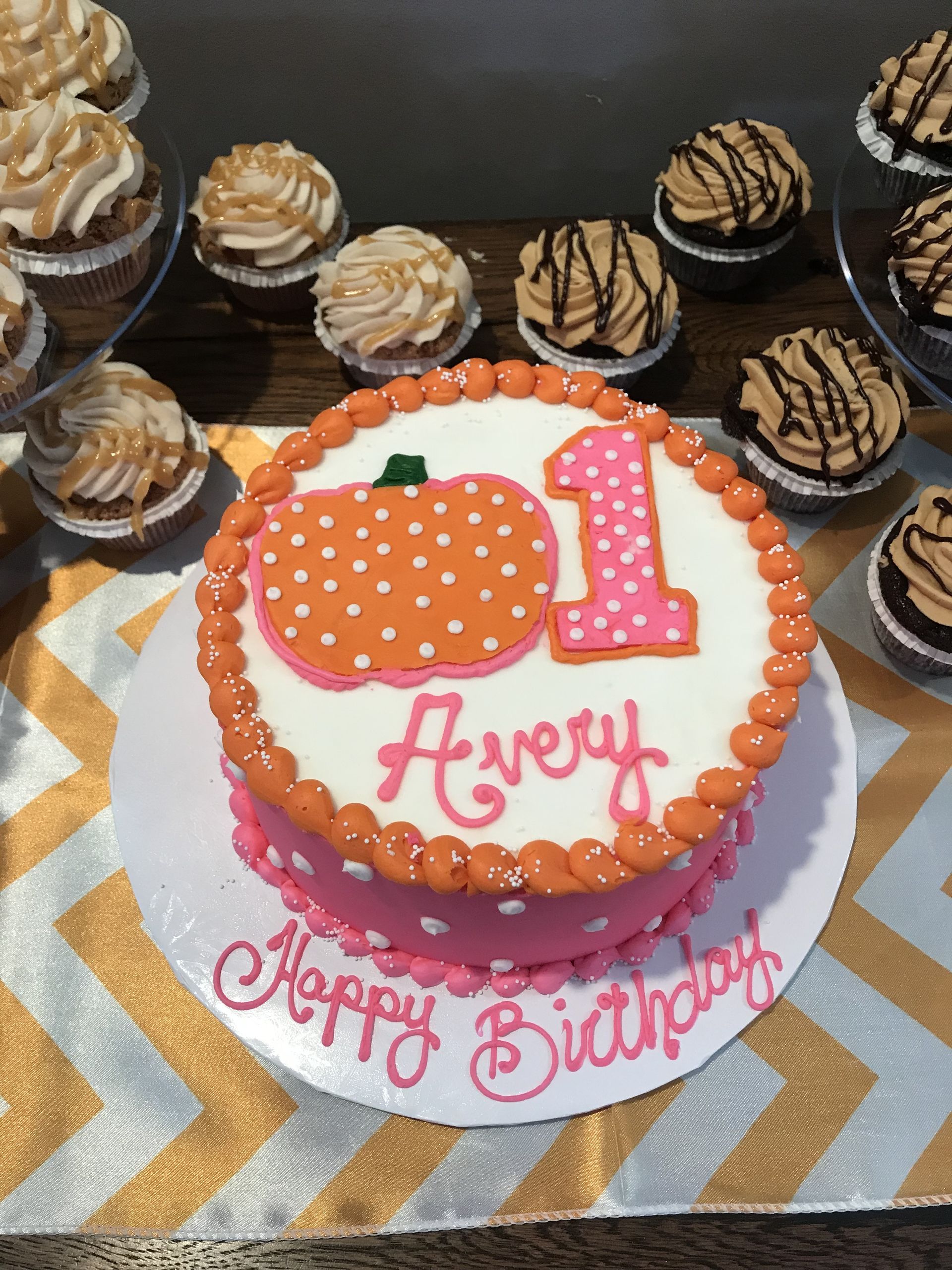 a birthday cake with a pumpkin and the number 1 on it