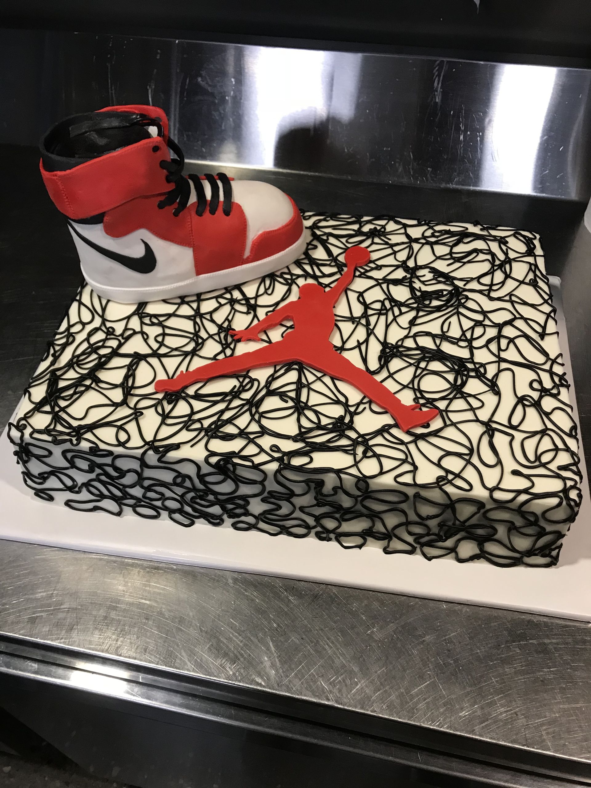 a cake with a jordan shoe on top of it
