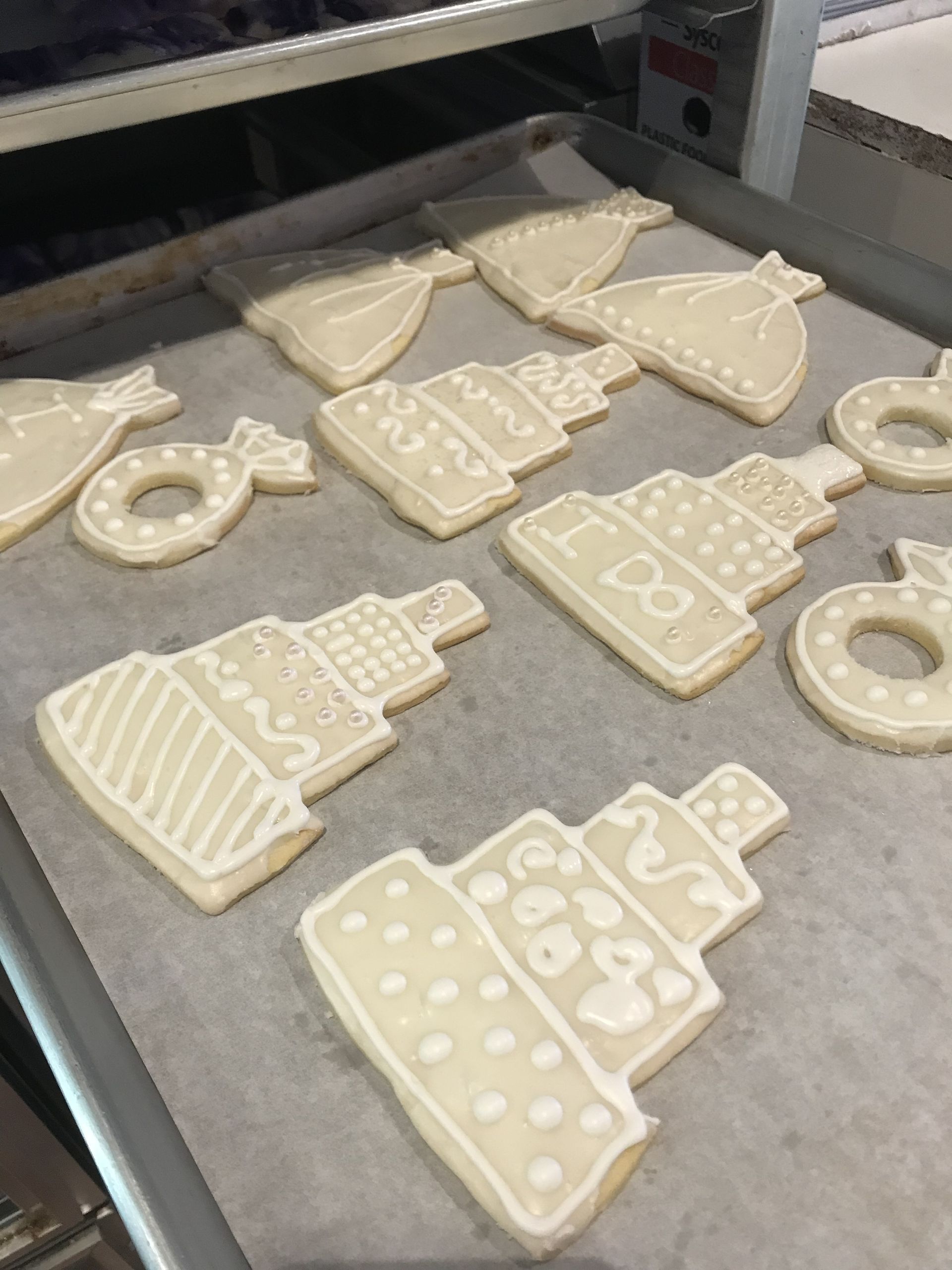 a bunch of cookies are sitting on a tray on a table .