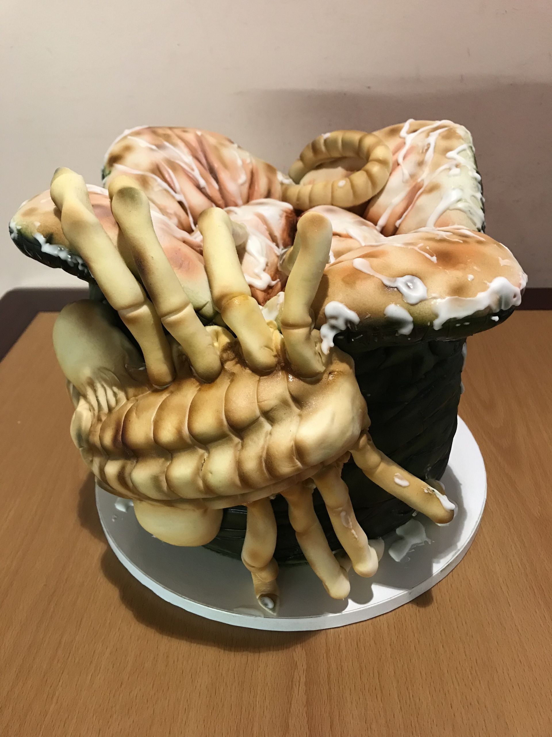 a cake that looks like a crab is sitting on a table .