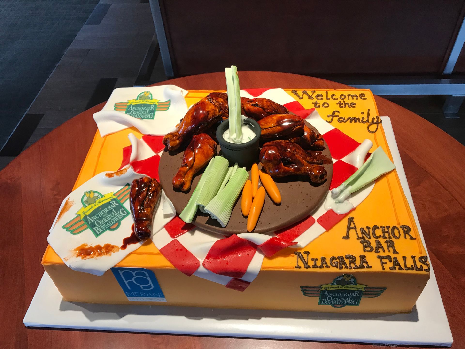 a cake that says welcome to the family on it