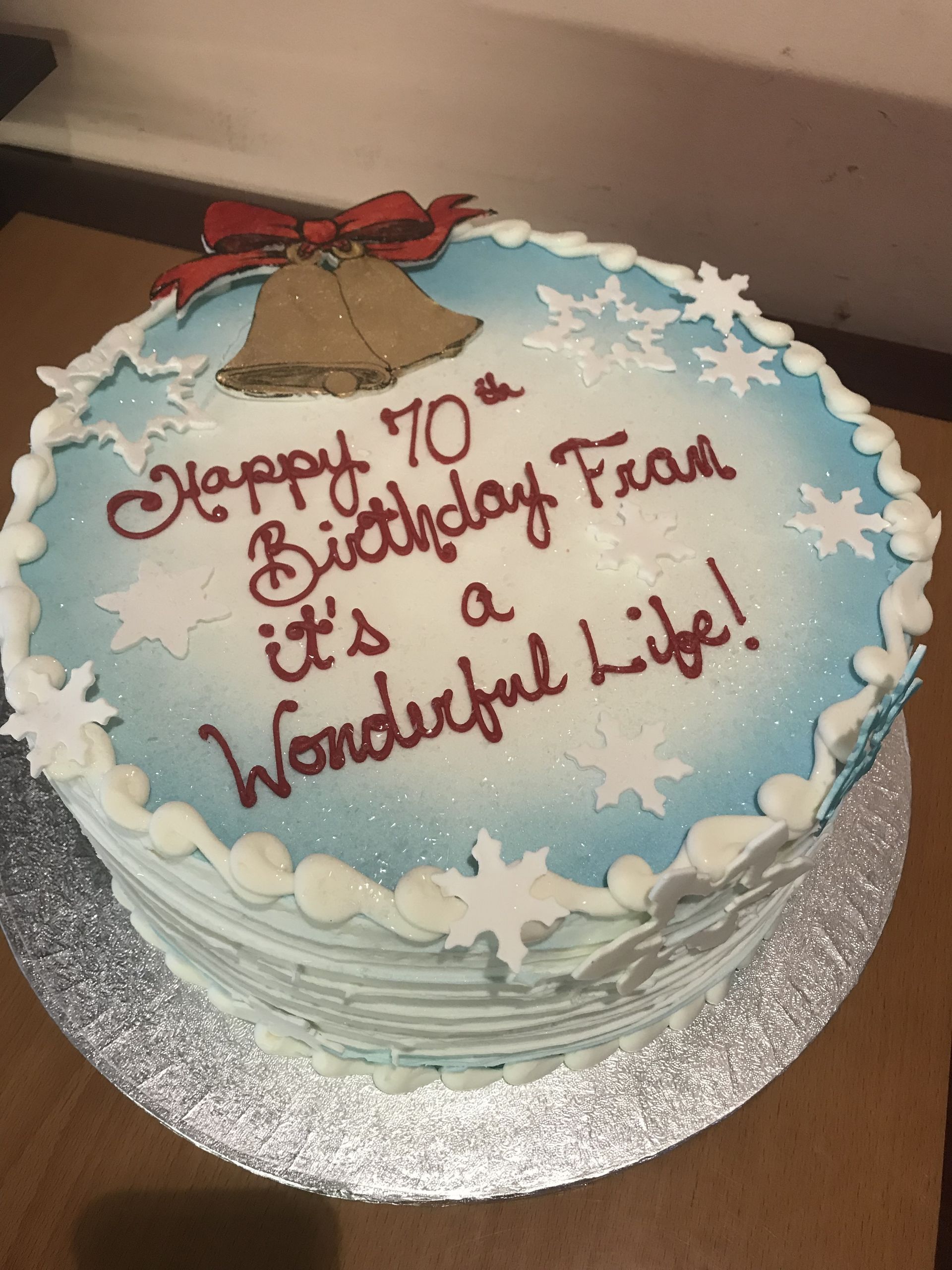 a birthday cake that says happy 70th birthday from it 's a wonderful life