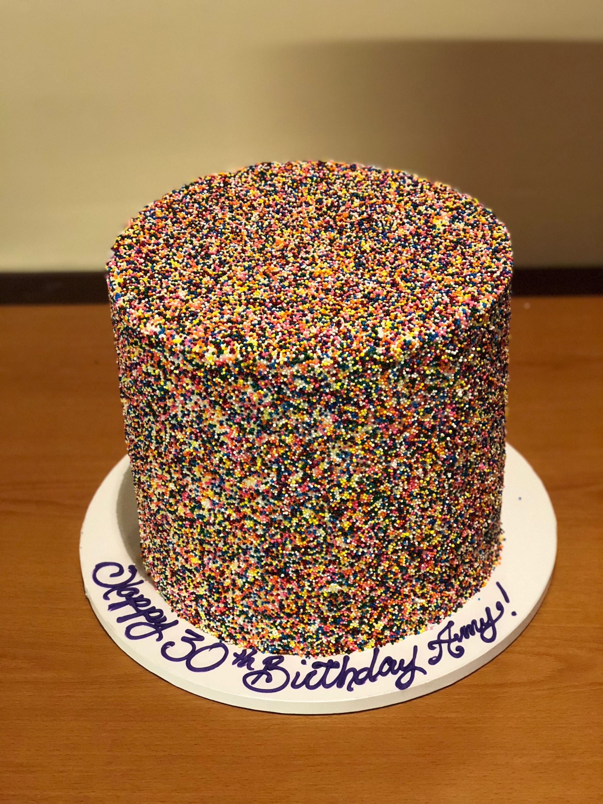 a birthday cake with a lot of sprinkles on it