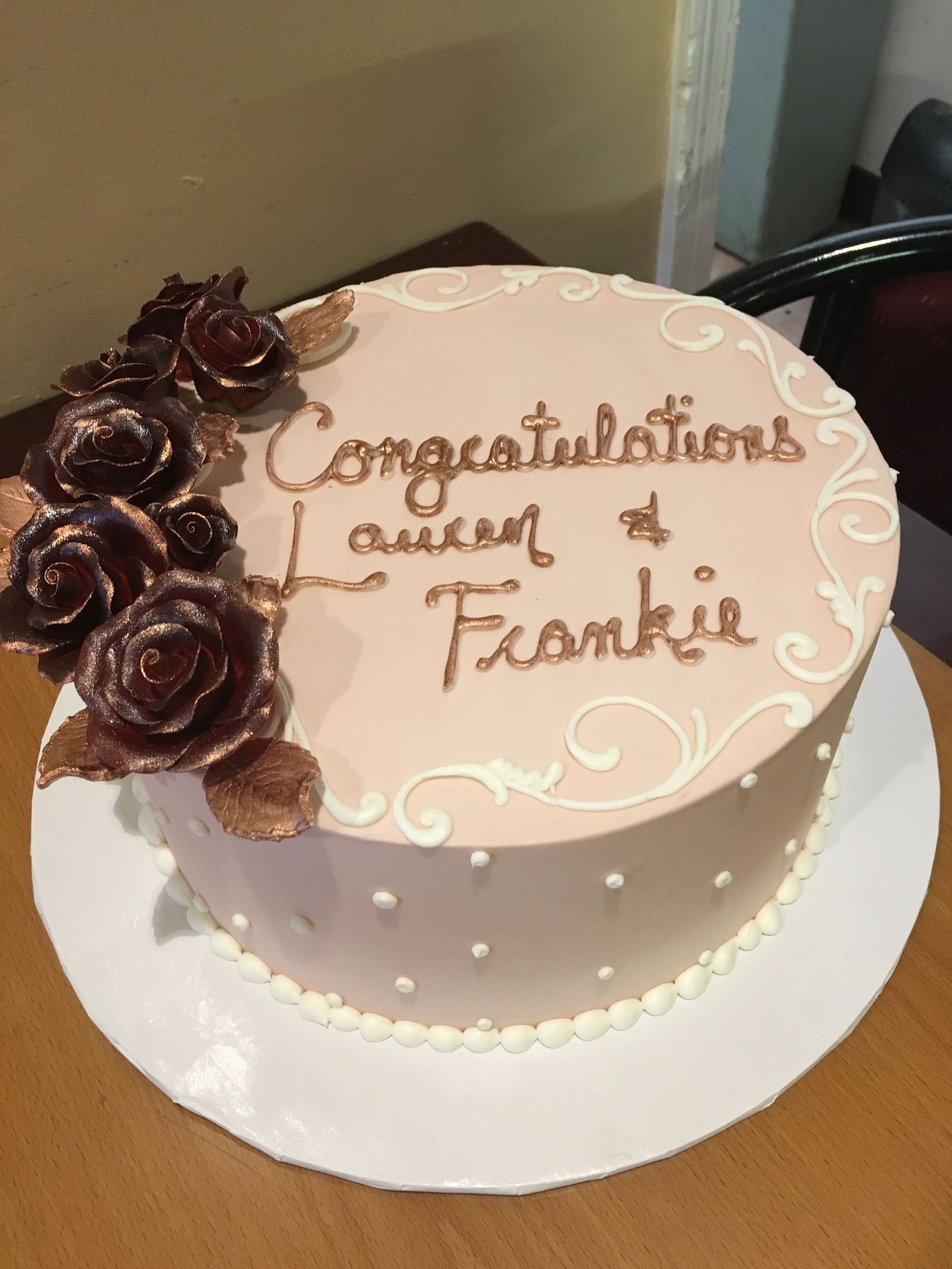 a cake that says congratulations lauren and frankie on it