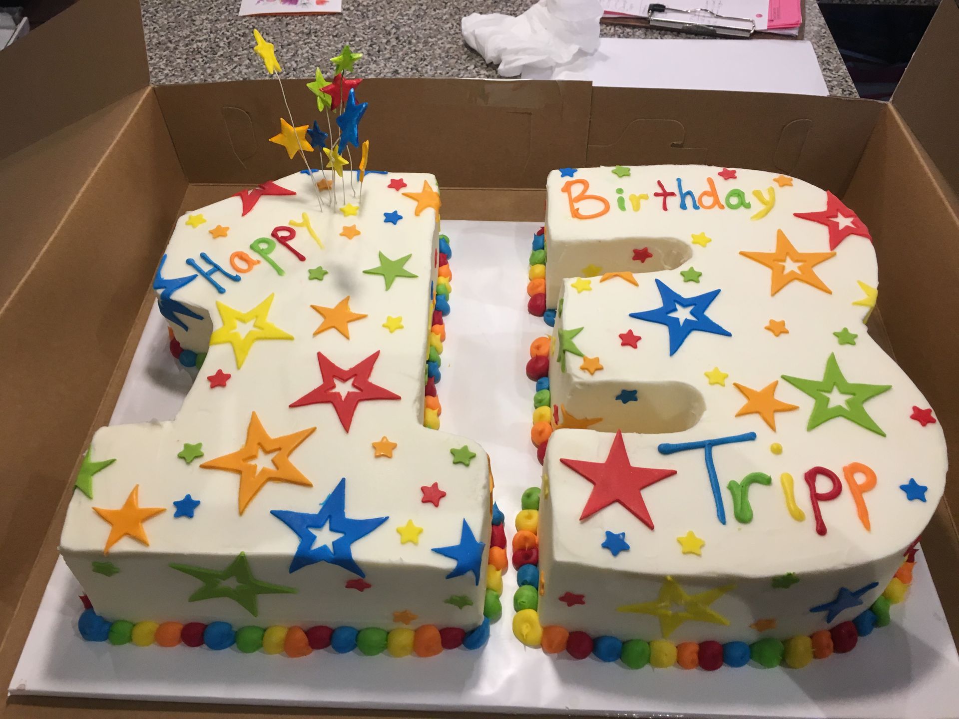 a birthday cake in the shape of the number 13