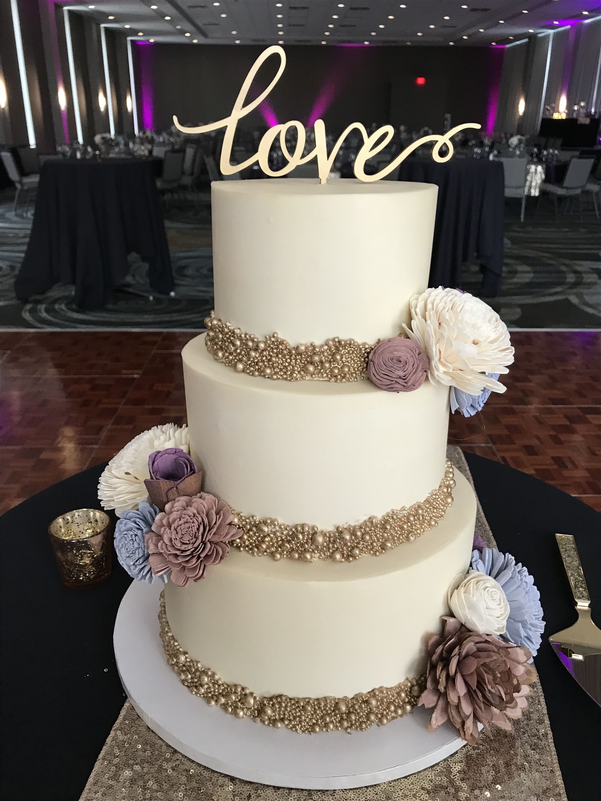 a wedding cake with the word love on it