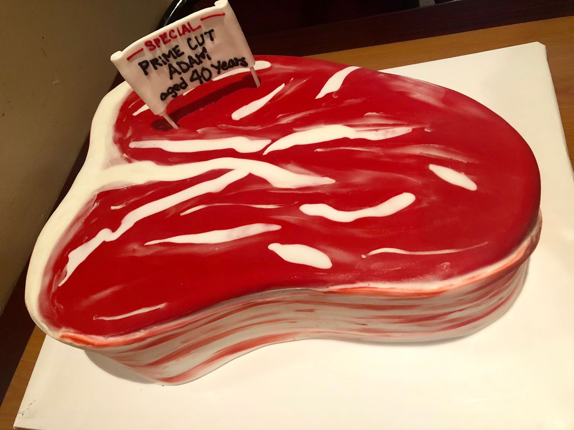 a cake in the shape of a piece of meat