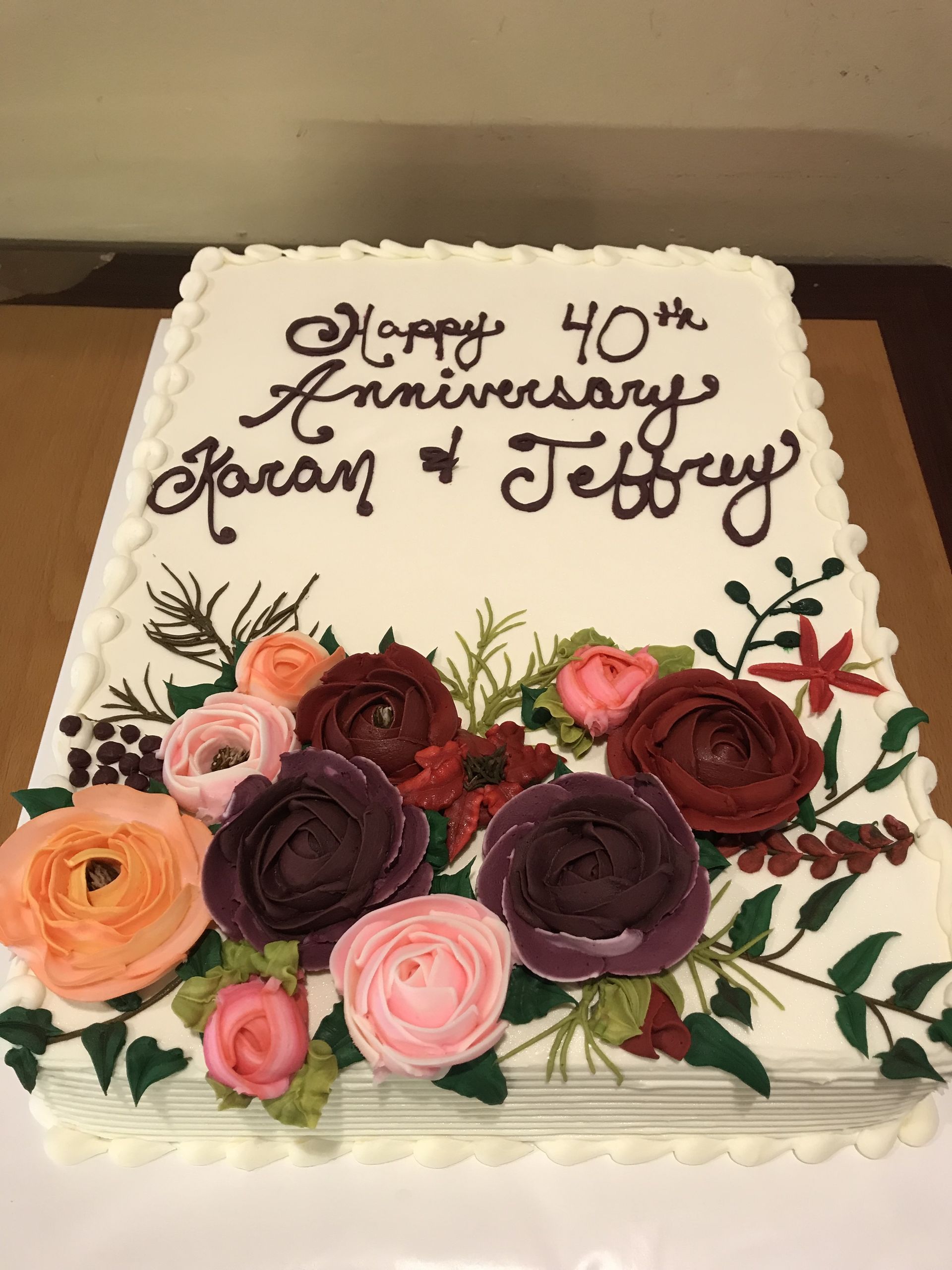 a 40th anniversary cake with flowers on it