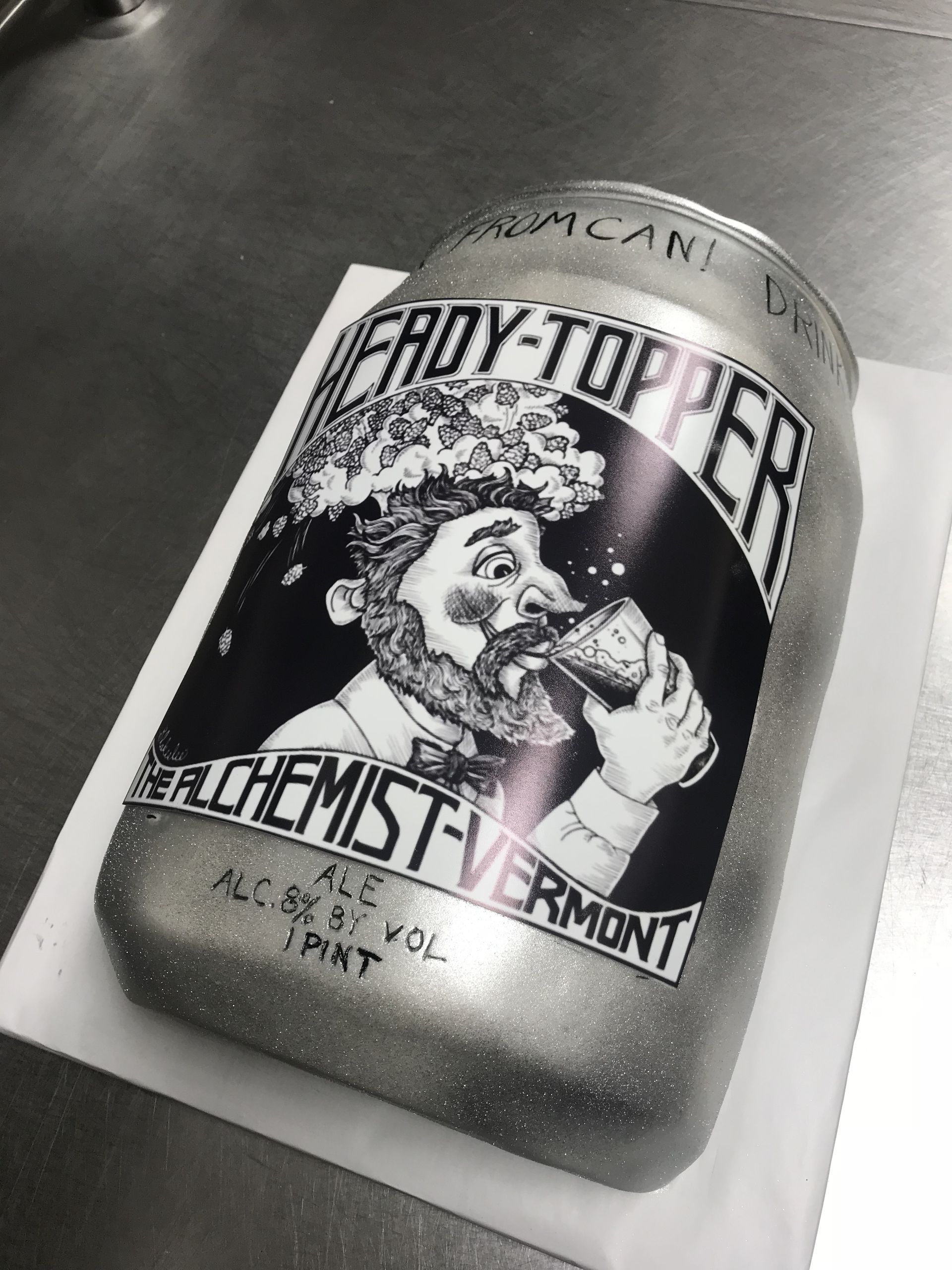 a cake in the shape of a can of froy-topper beer