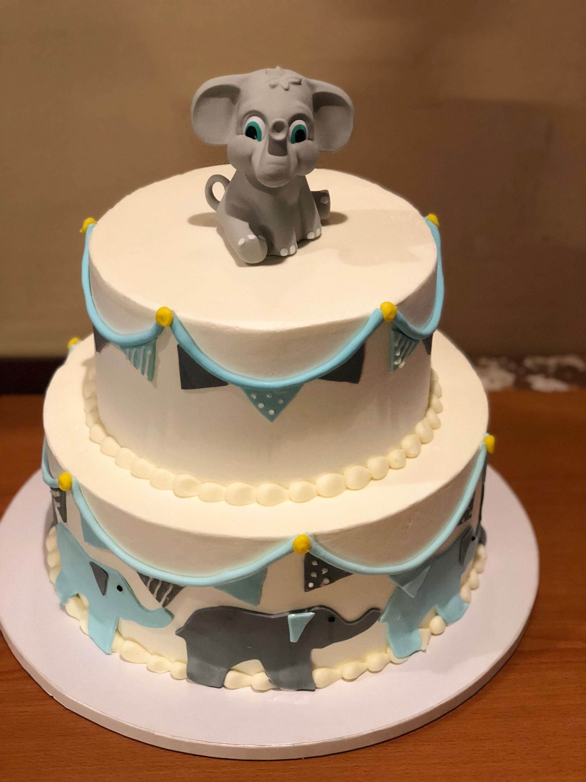 a cake with an elephant on top of it