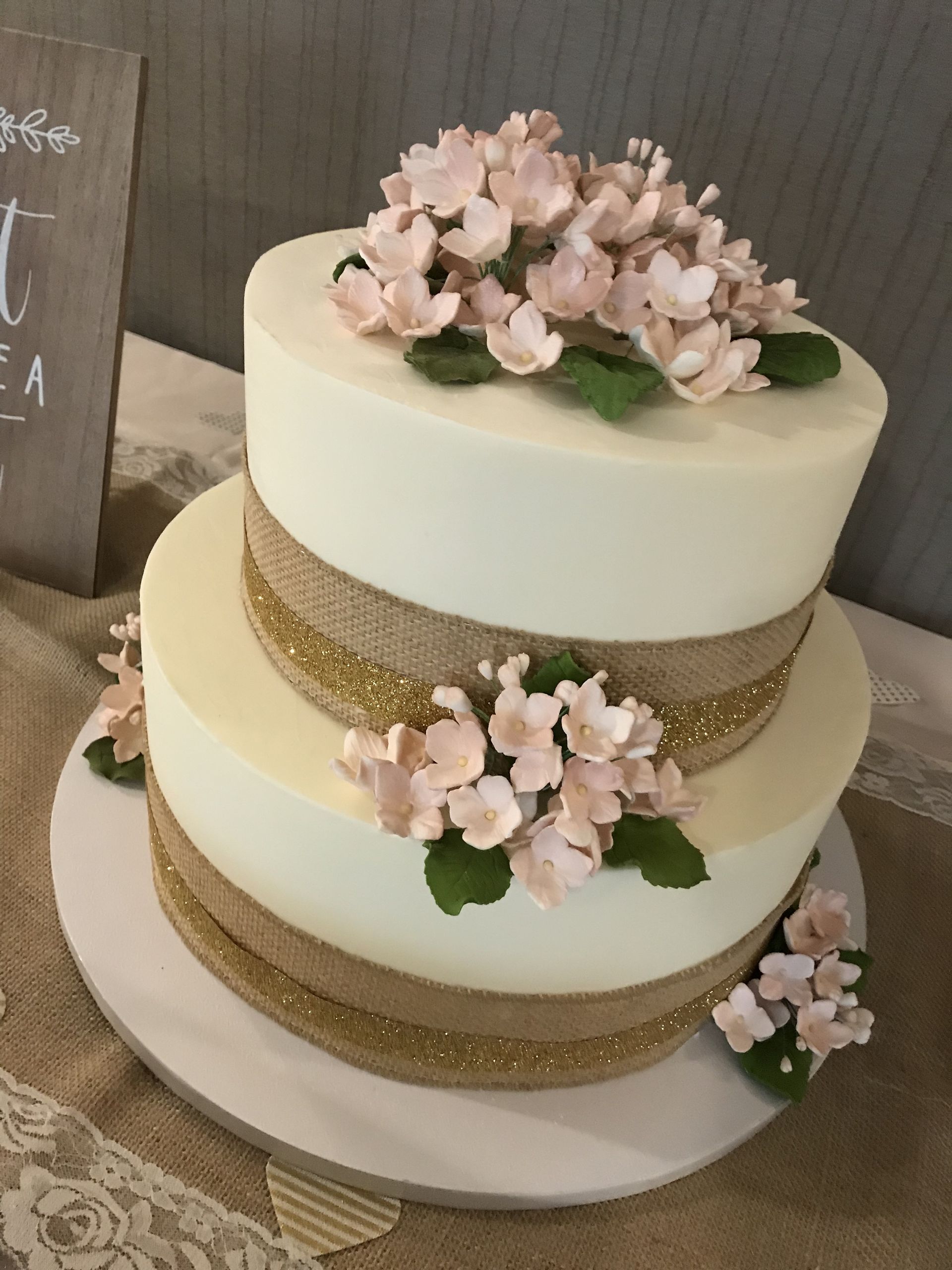 a white cake with pink flowers on top of it