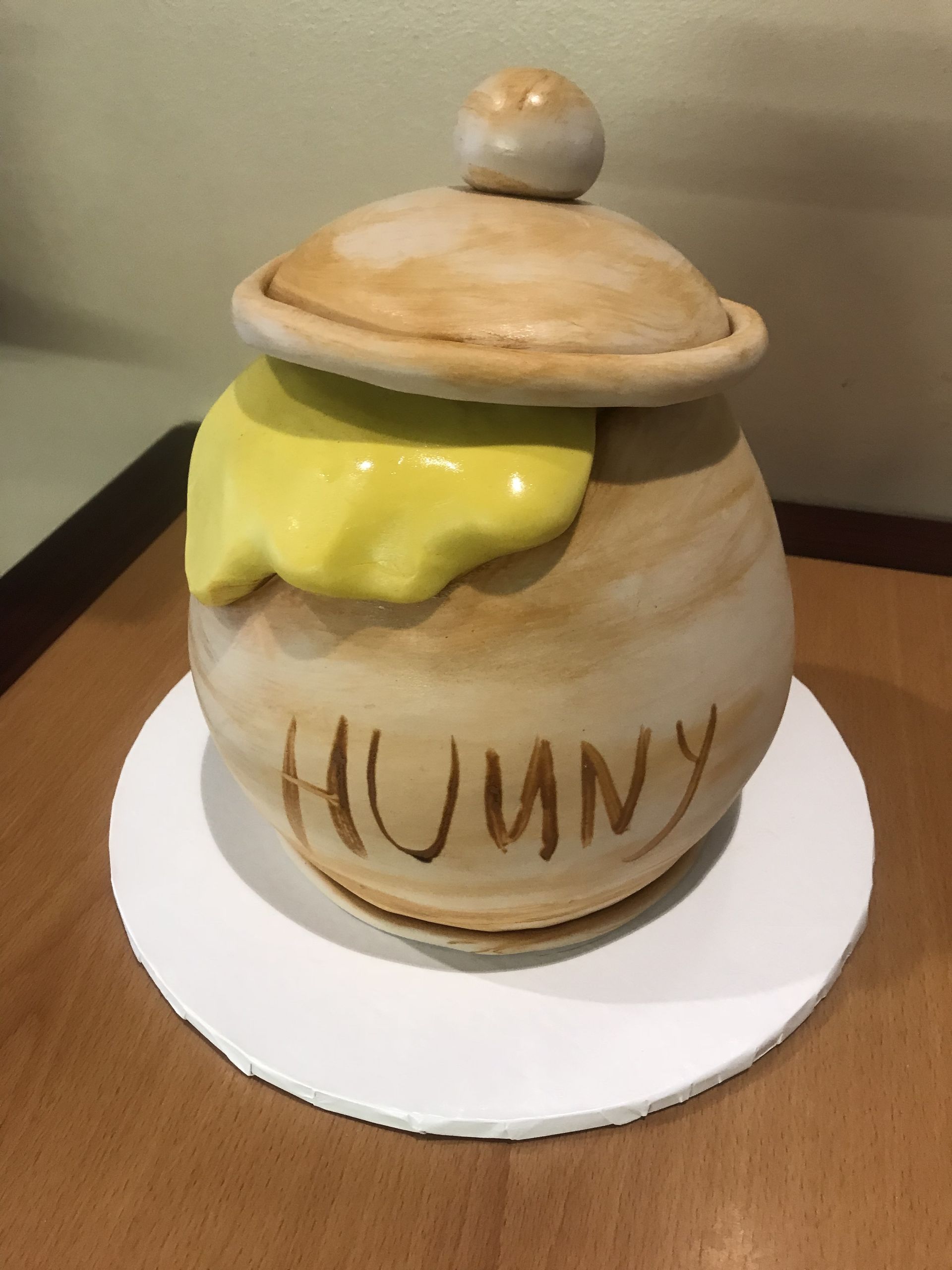 a ceramic pot with the word hunny on it