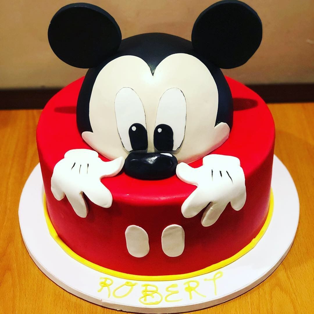 a mickey mouse cake with the name robert on it