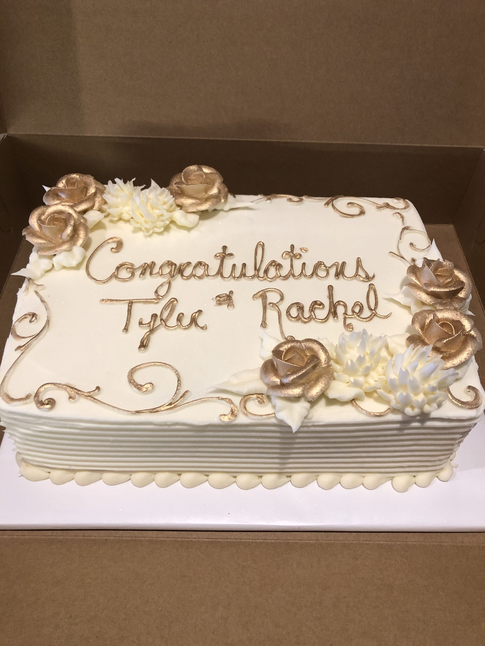 a cake that says congratulations tyler and rachel on it