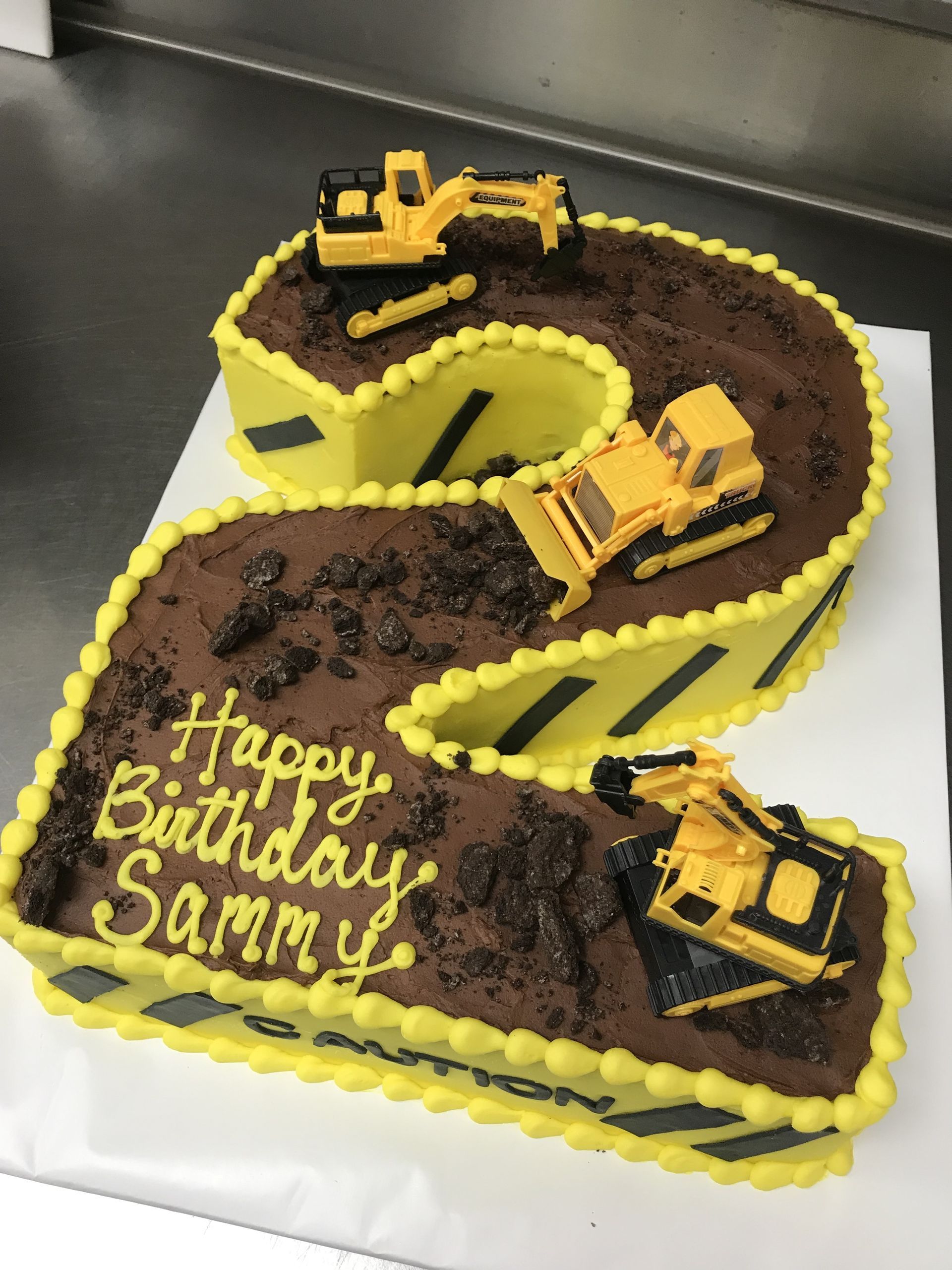 a birthday cake in the shape of the number 2