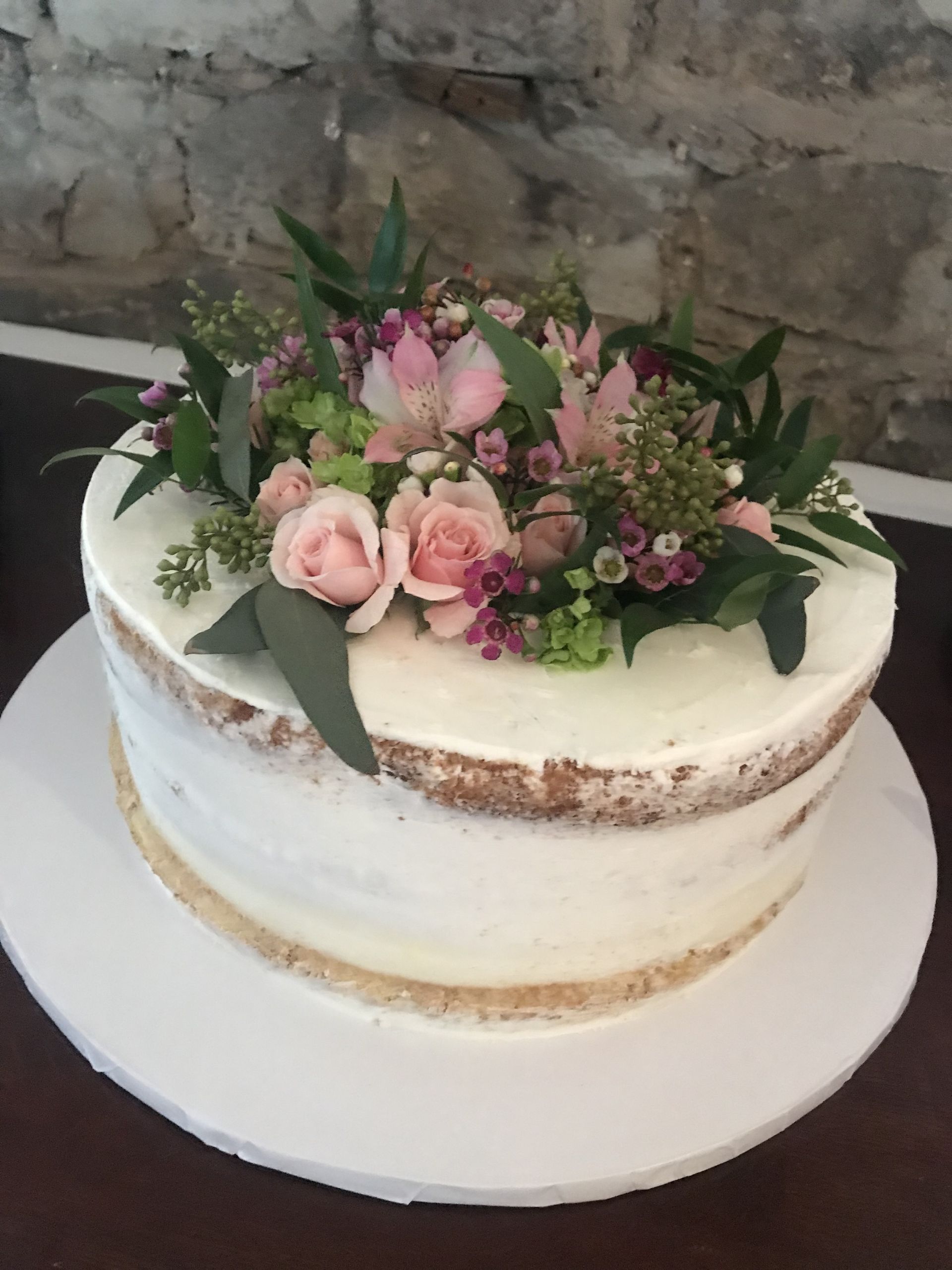 a cake with flowers on top of it on a table
