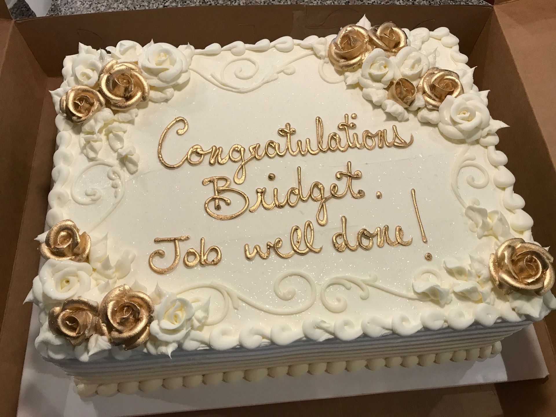 a cake with congratulations bridget written on it