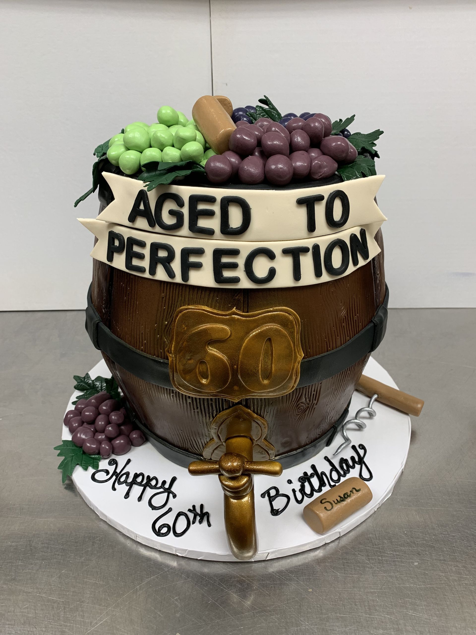 a cake that says aged to perfection on it