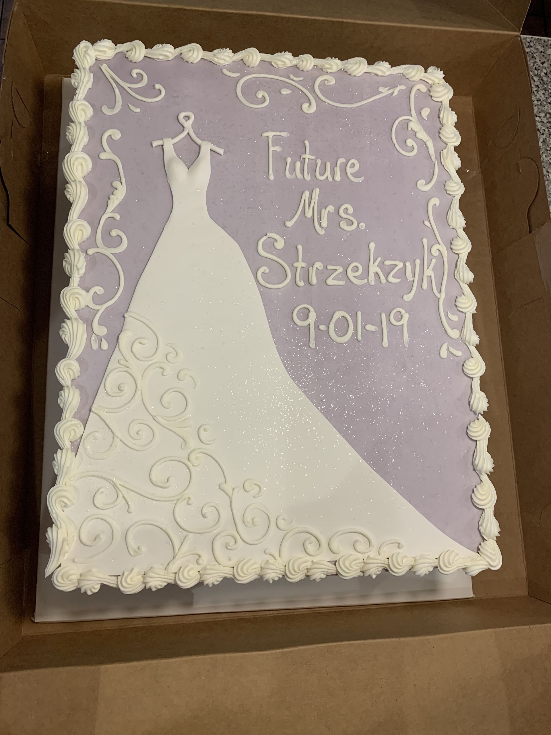 a cake with a picture of a wedding dress on it