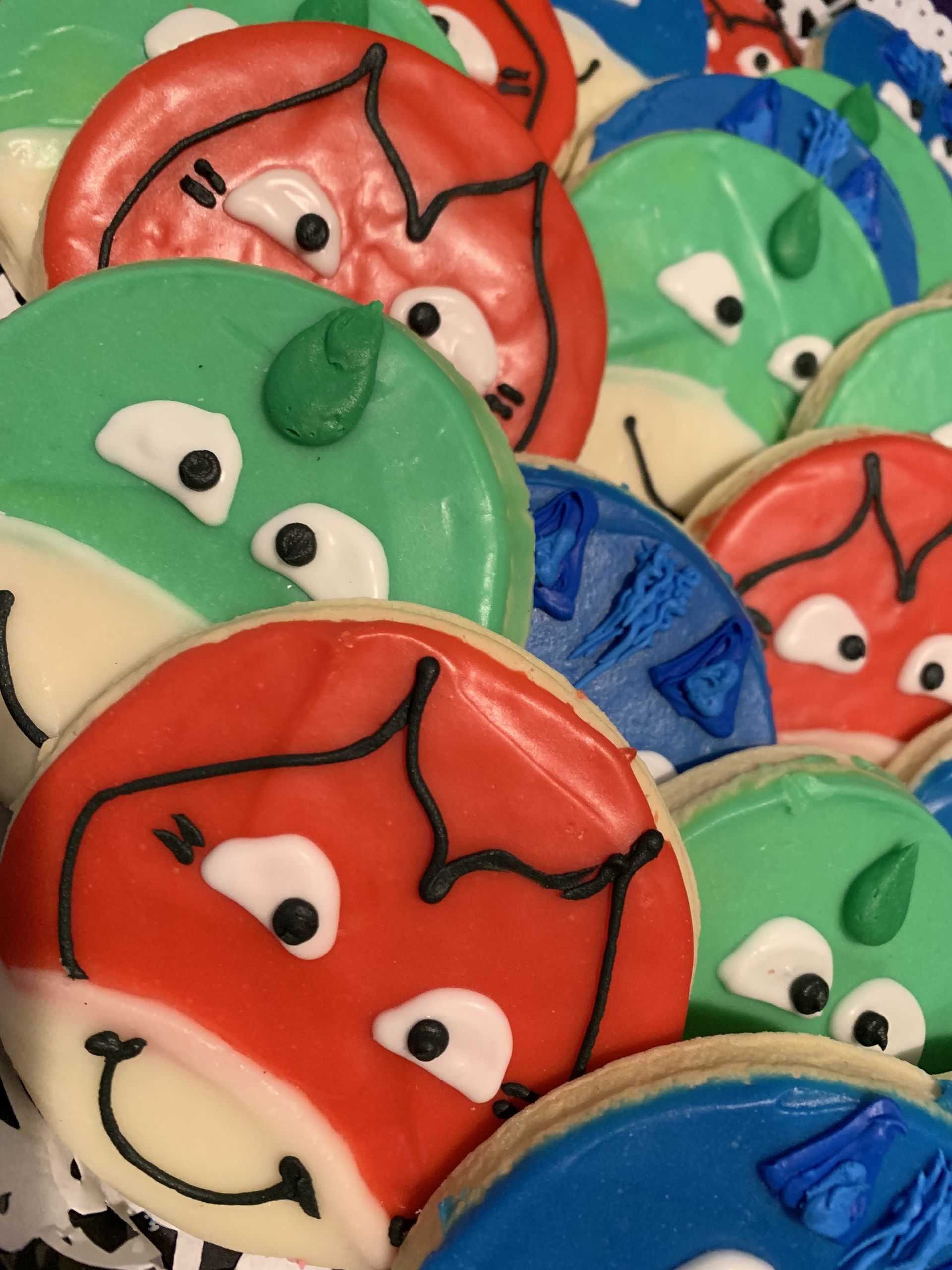 a bunch of cookies with faces on them