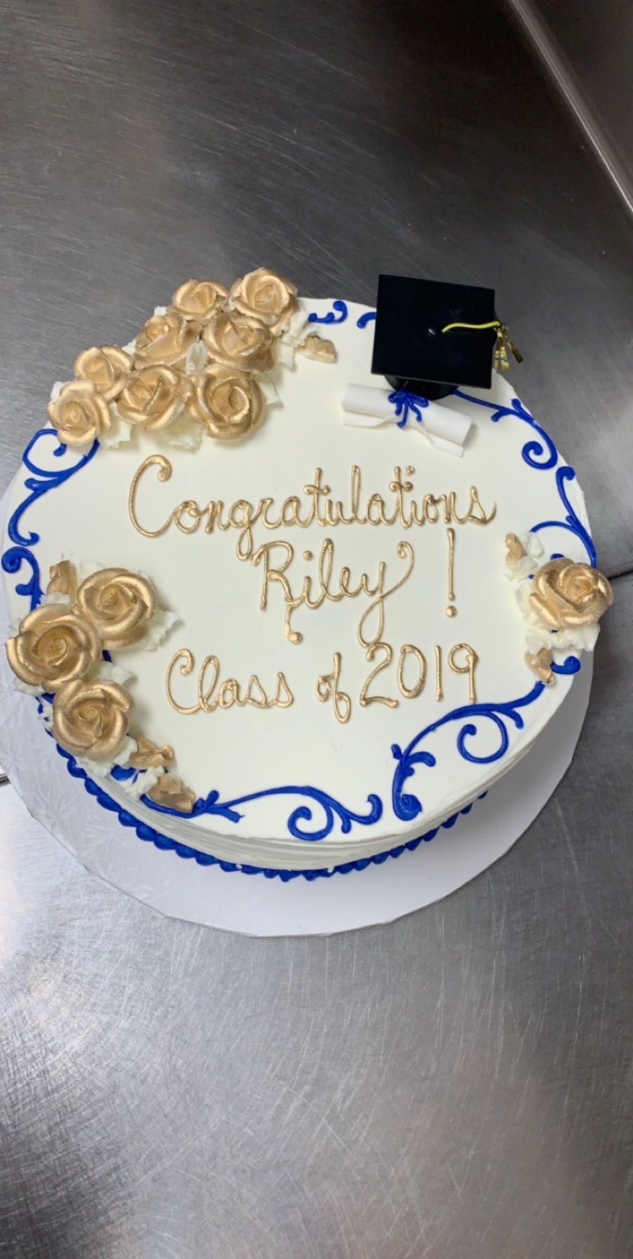 a cake with a graduation cap on top of it .