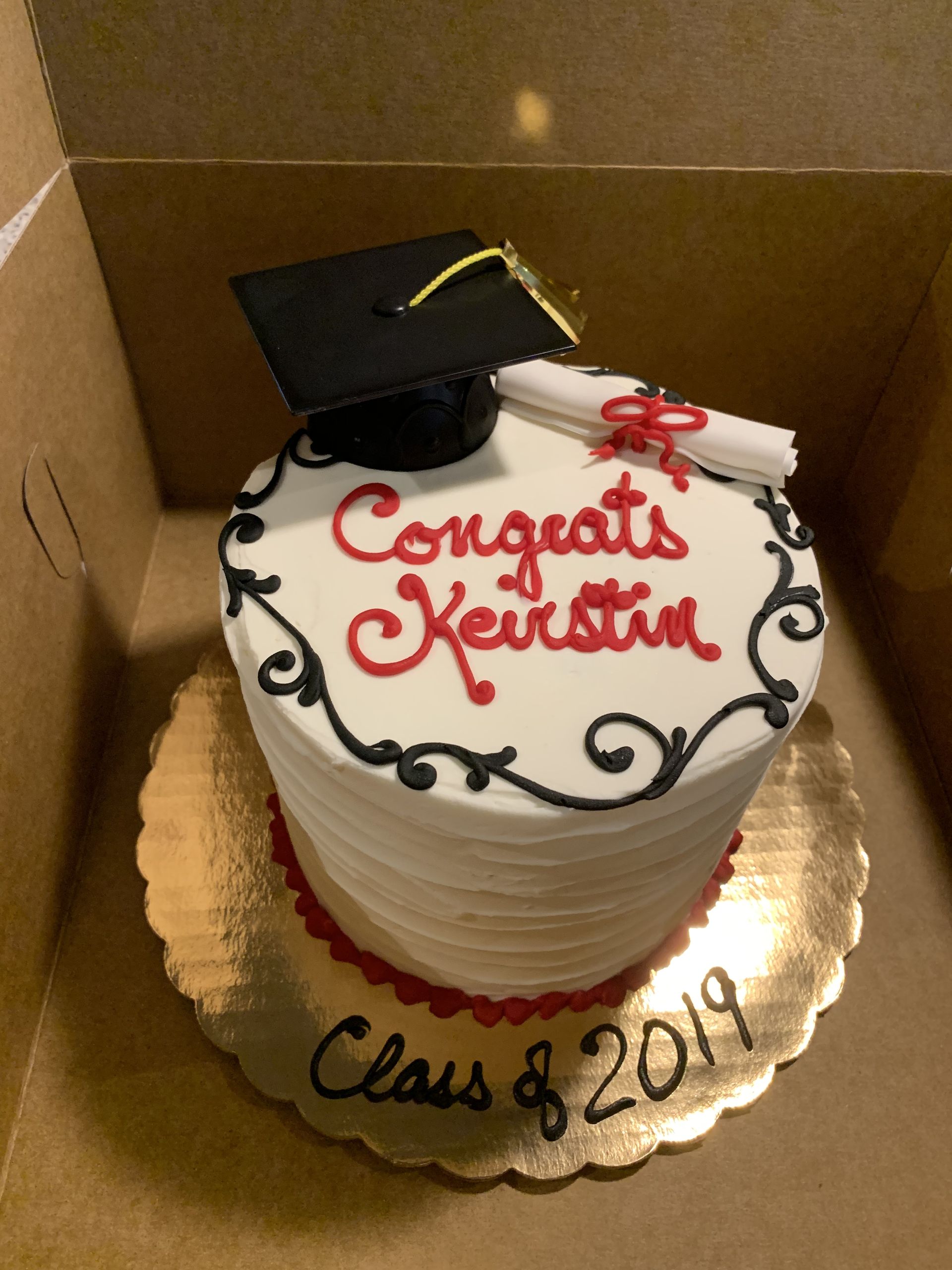 a graduation cake with congratulations written on it
