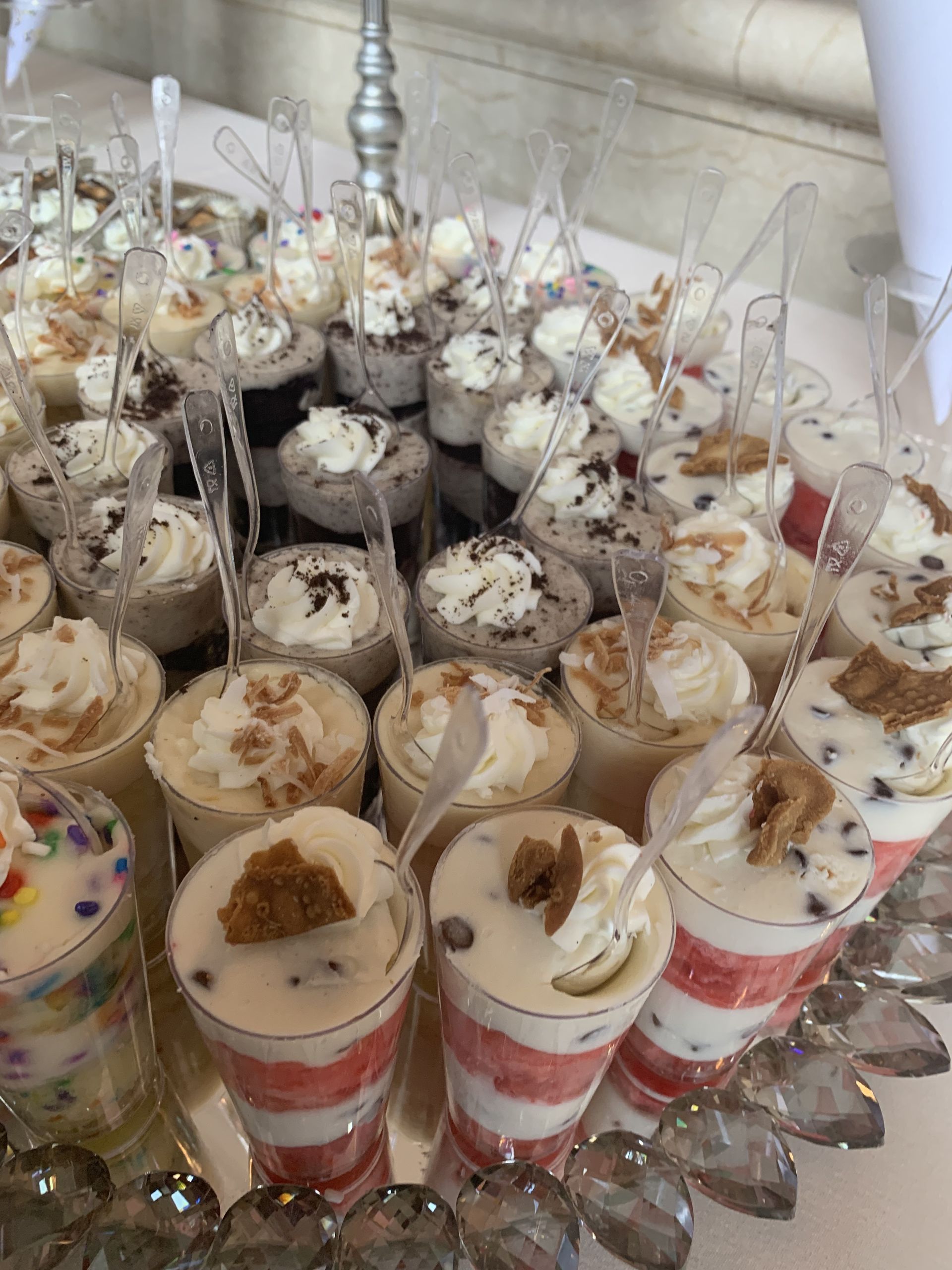 a table topped with a variety of desserts and cupcakes .
