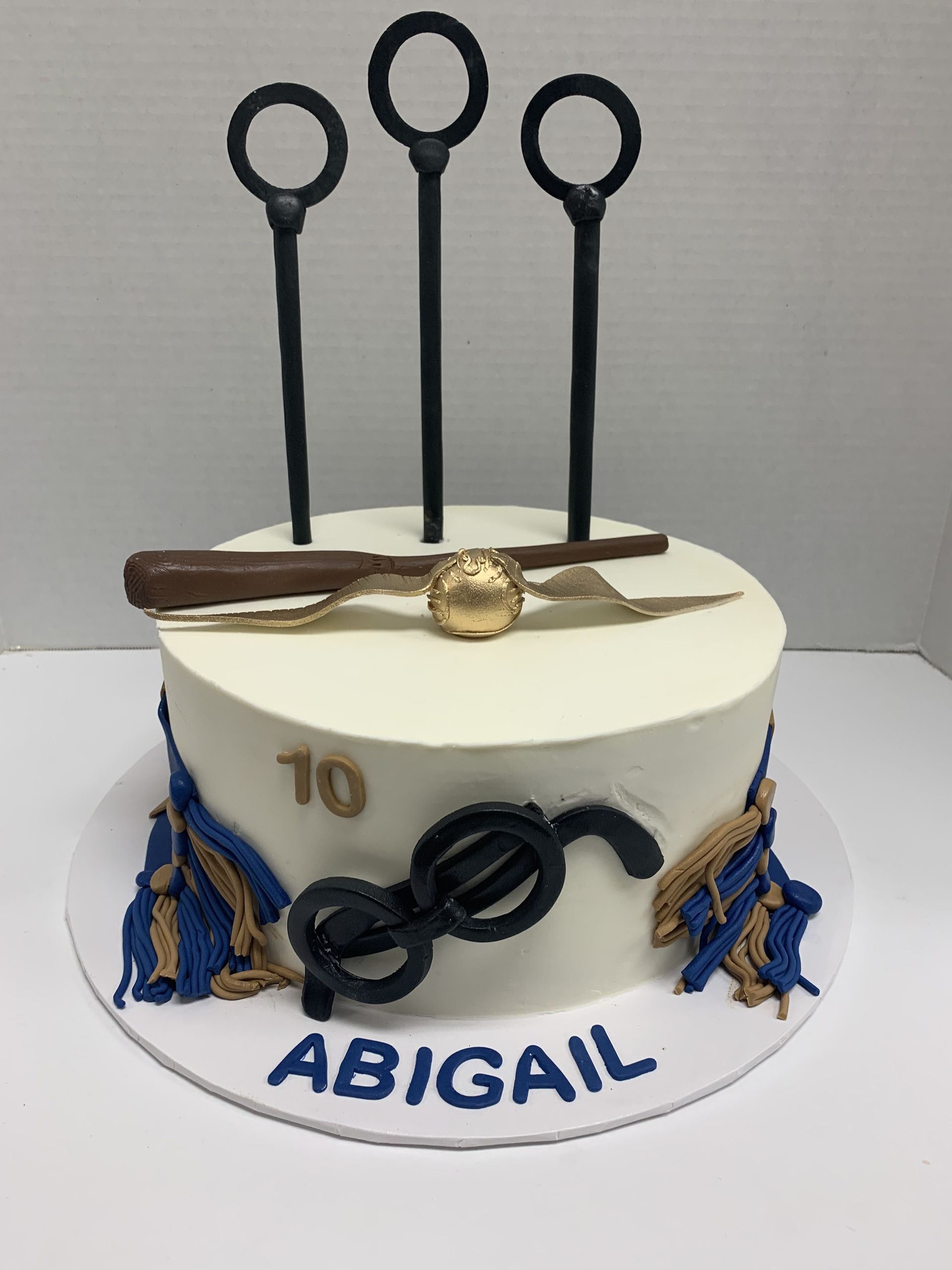 a white cake with the name abigail on it