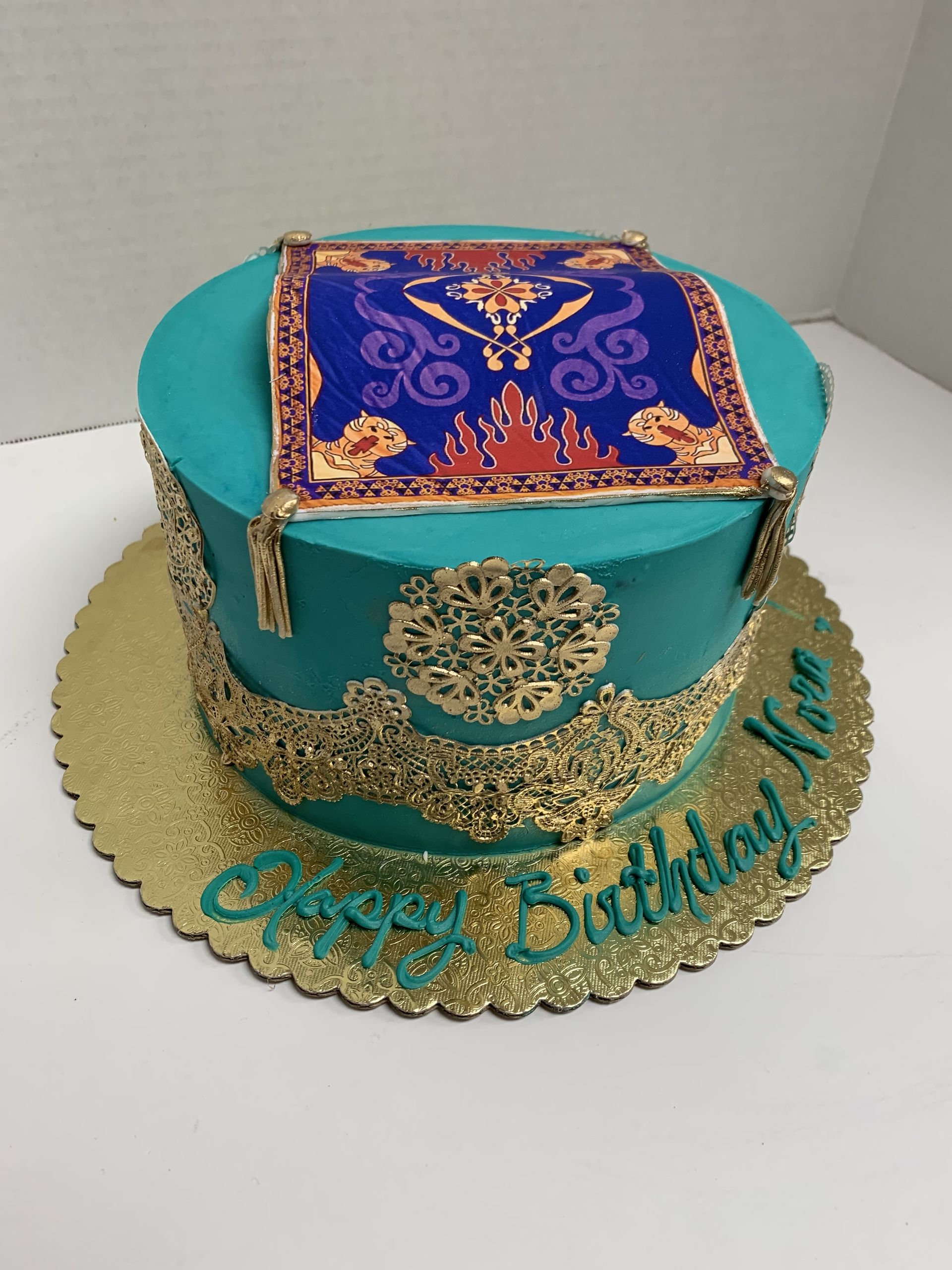 a birthday cake with a carpet on top of it