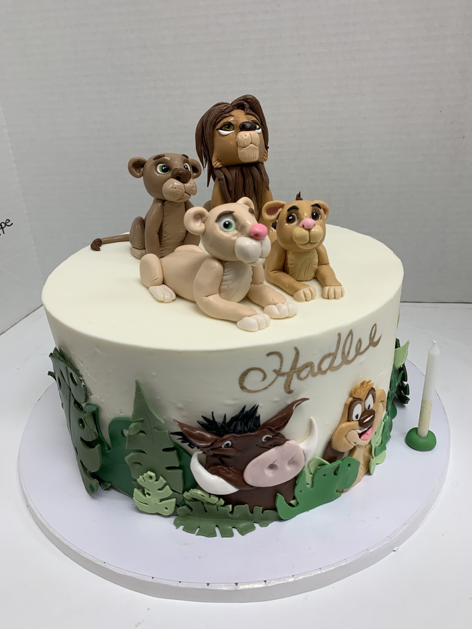 a cake with the lion king characters on it